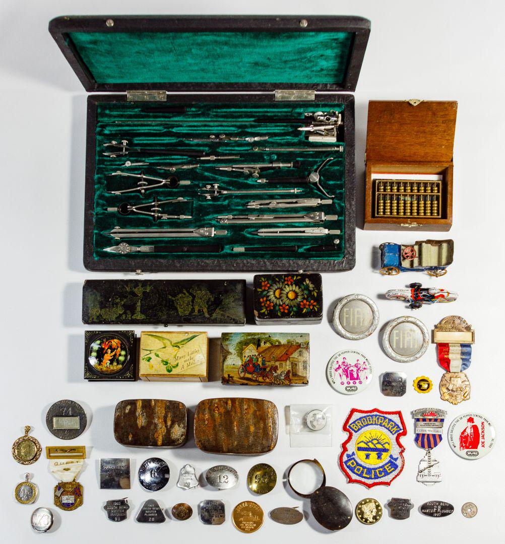 Boxes, Pendants, Badges and Drafting Set Assortment: Boxes, Pendants, Badges and Drafting Set Assortment Including badges with examples from Commonwealth Edison Co. and South Bend master plumber, some marked 'sterling', 'Childs' and 'Meyer & Wenthe'; tw