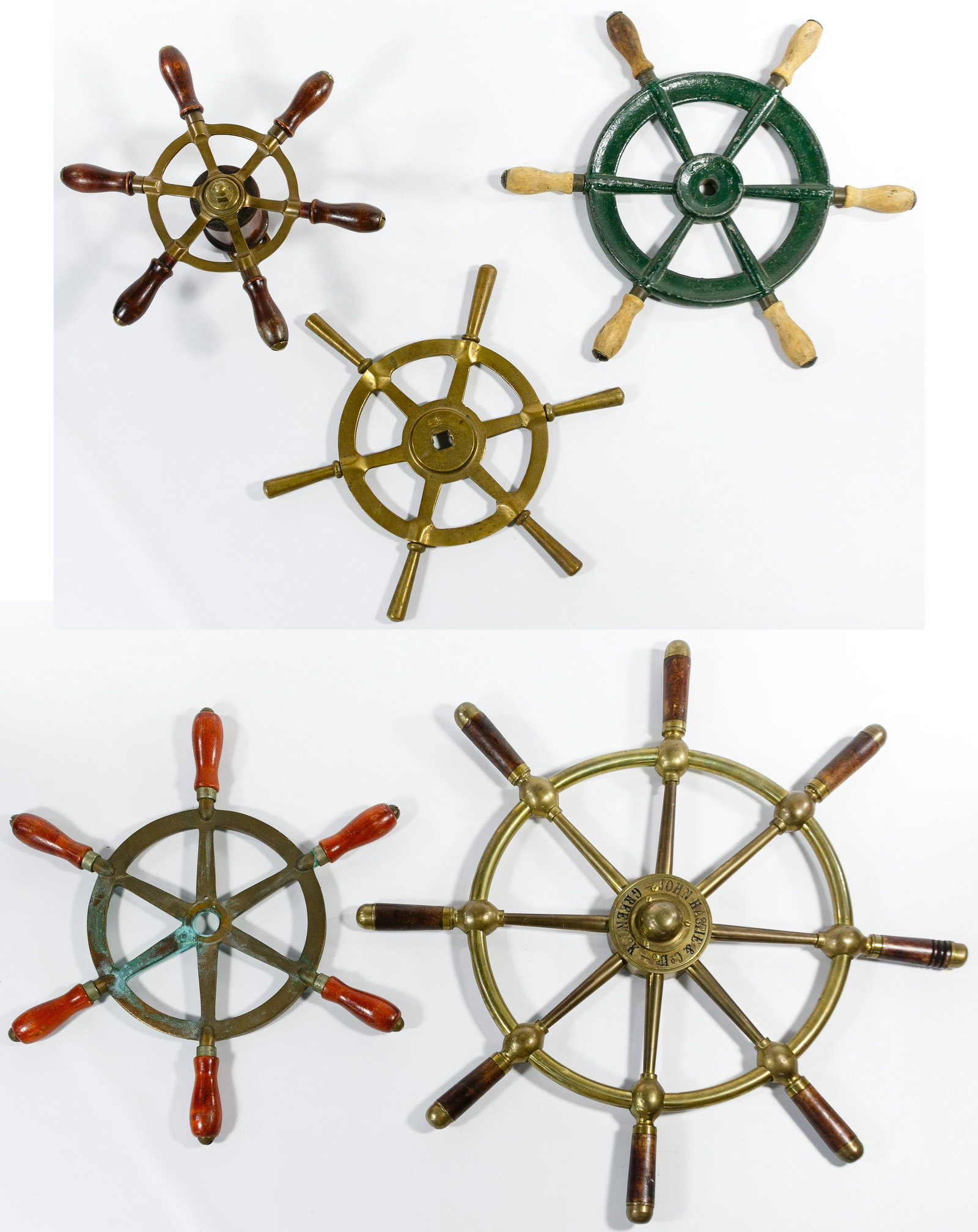Nautical Ship Wheel Assortment: Nautical Ship Wheel Assortment Five wheels including four having brass and wood construction and one having cast iron and wood construction Condition: Very Good to Good, light to moderate surface wear