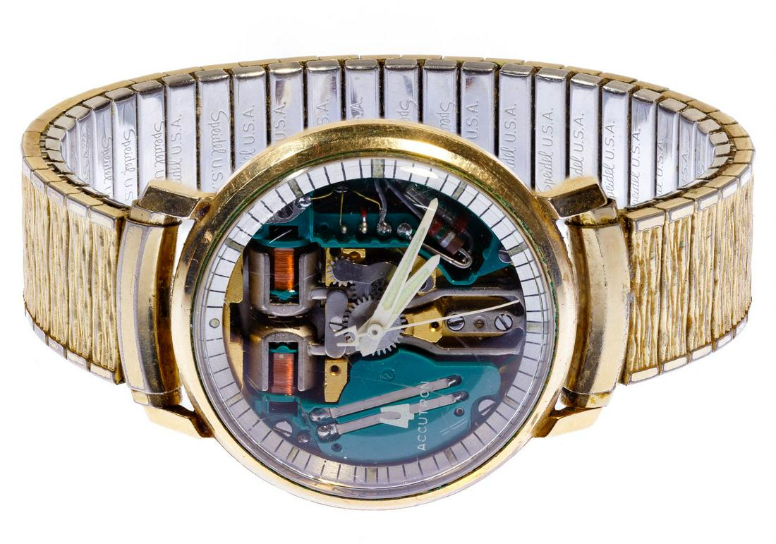 Bulova Accutron 'Spaceview' Skeleton Wrist Watch: Bulova Accutron 'Spaceview' Skeleton Wrist Watch Having a clear face revealing the works; sweep second hand; time setting on back of case Condition: Good, overall moderate wear and scratches; new batt