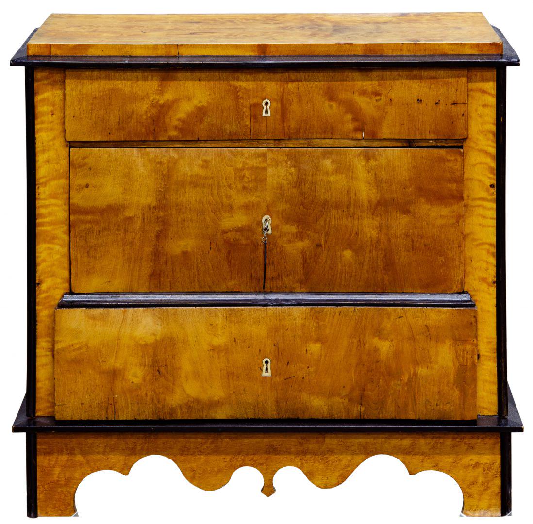 Biedermeier Satinwood Chest of Drawers: Biedermeier Satinwood Chest of Drawers Having three locking drawers with brass hardware, black painted trim; including key Condition: Good, overall light to moderate wear consistent with age and norma