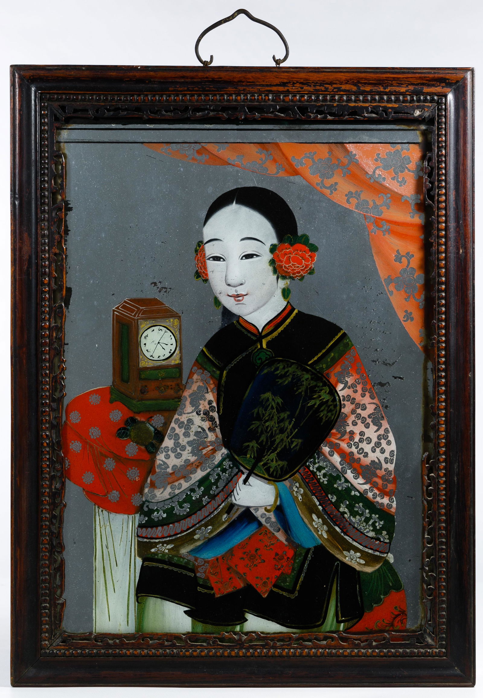 Chinese Late Qing Dynasty Reverse Glass Painting: Chinese Late Qing Dynasty Reverse Glass Painting Undated, unsigned, depicting a young woman holding a fan, mounted in a carved wooden frame Condition: Very Good, minor losses and discoloration of silv