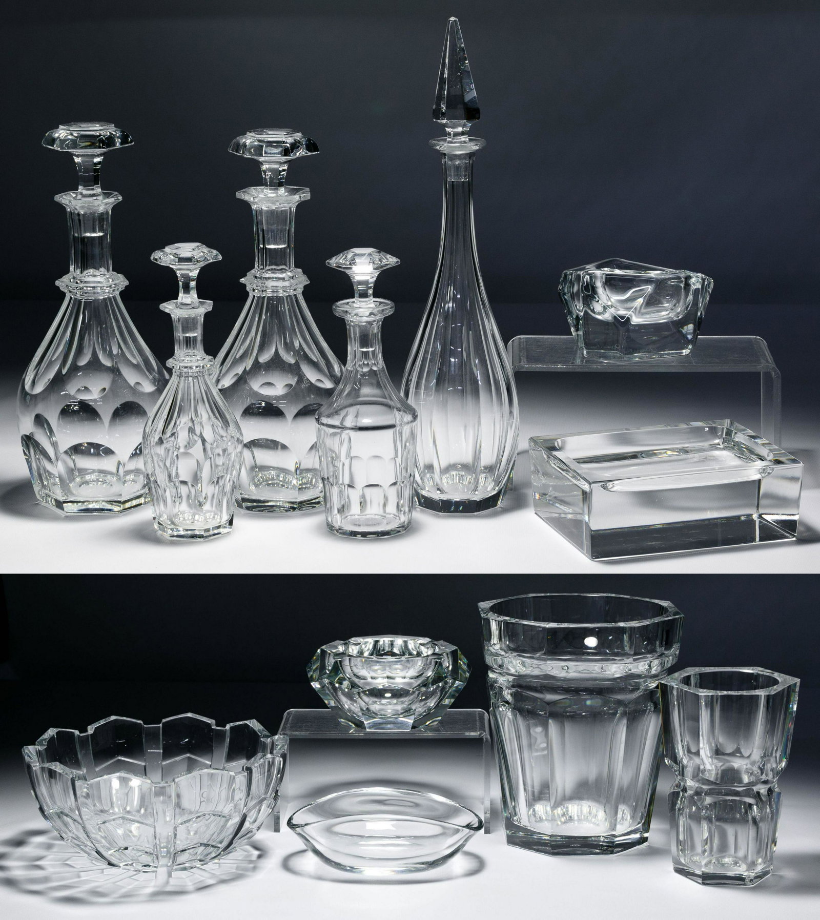Baccarat Crystal Assortment: Baccarat Crystal Assortment Twelve items all having maker marks including five Baccarat decanters with stoppers, ice bucket, vase, ash tray, serving bowl, and decorative bowl; together with a Daum ash