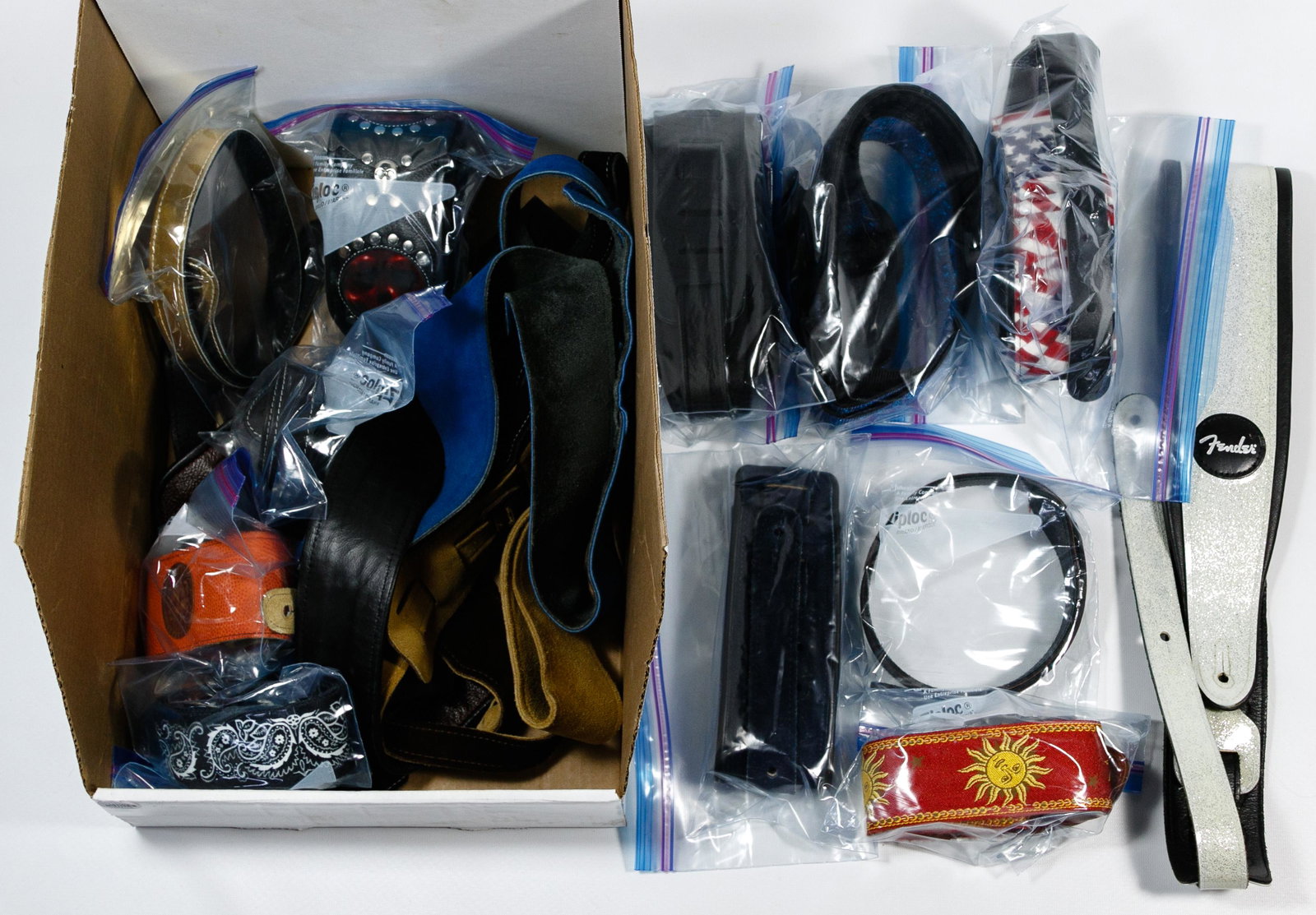 Guitar Strap Assortment: Guitar Strap Assortment Sixteen items including a Fender strap having white glitter vinyl Condition: Very Good, overall light wear consistent with age and normal use Length: 48 inches, Width: 3 1/4 in