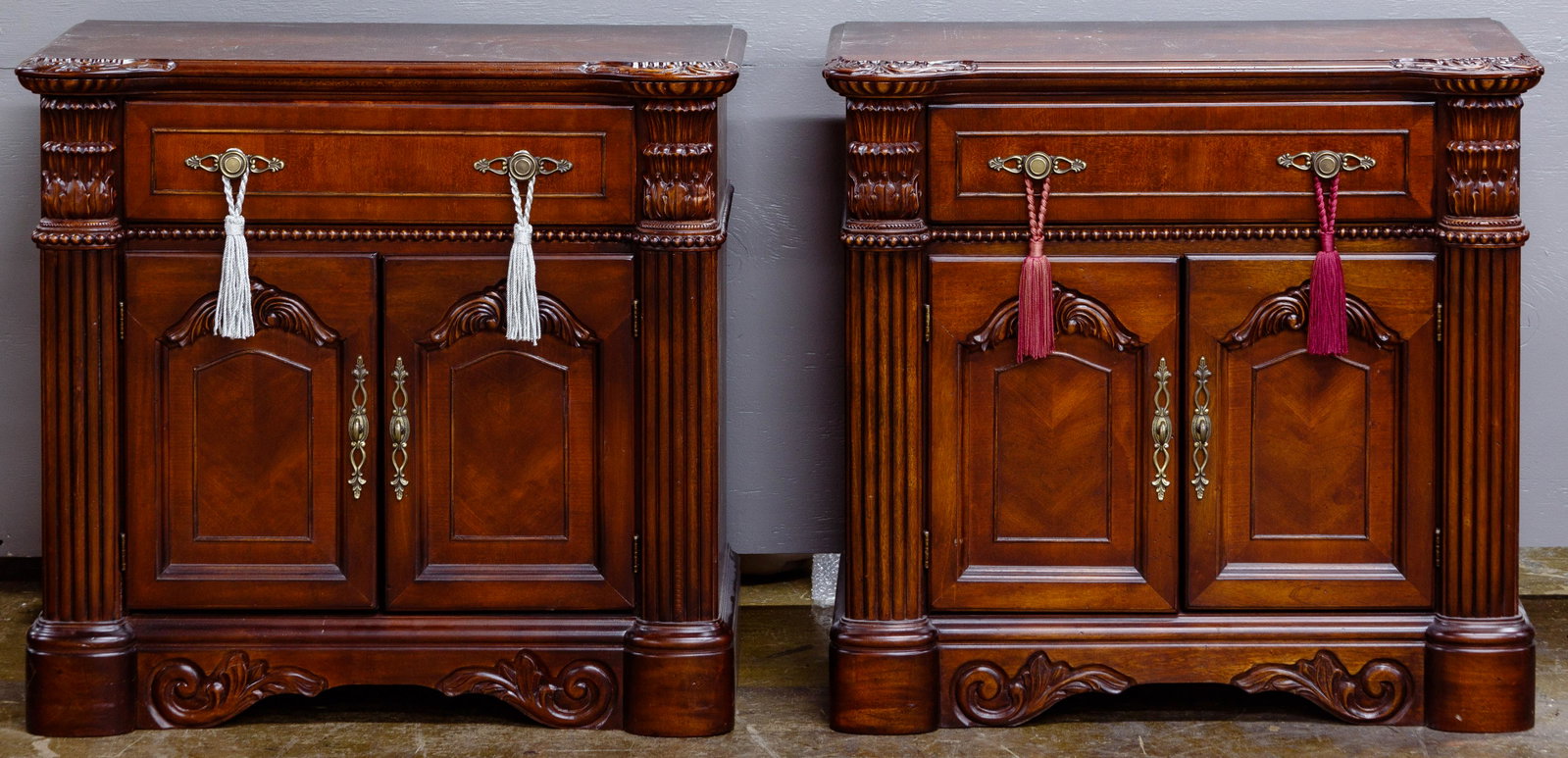 Mahogany Stained Night Stands / End Tables: Mahogany Stained Night Stands / End Tables Pair; having a full width drawer over double doors flanked by fluted columns Condition: Very Good to Good, overall moderate wear, minor finish loss; one havi