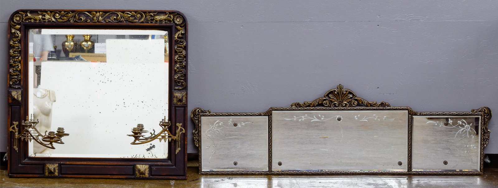 Framed Beveled Mirrors: Framed Beveled Mirrors Two items including a sofa mirror having three sections and a wall mirror having two attached candle holders; both in carved wood frames Condition: Very Good, overall light to m