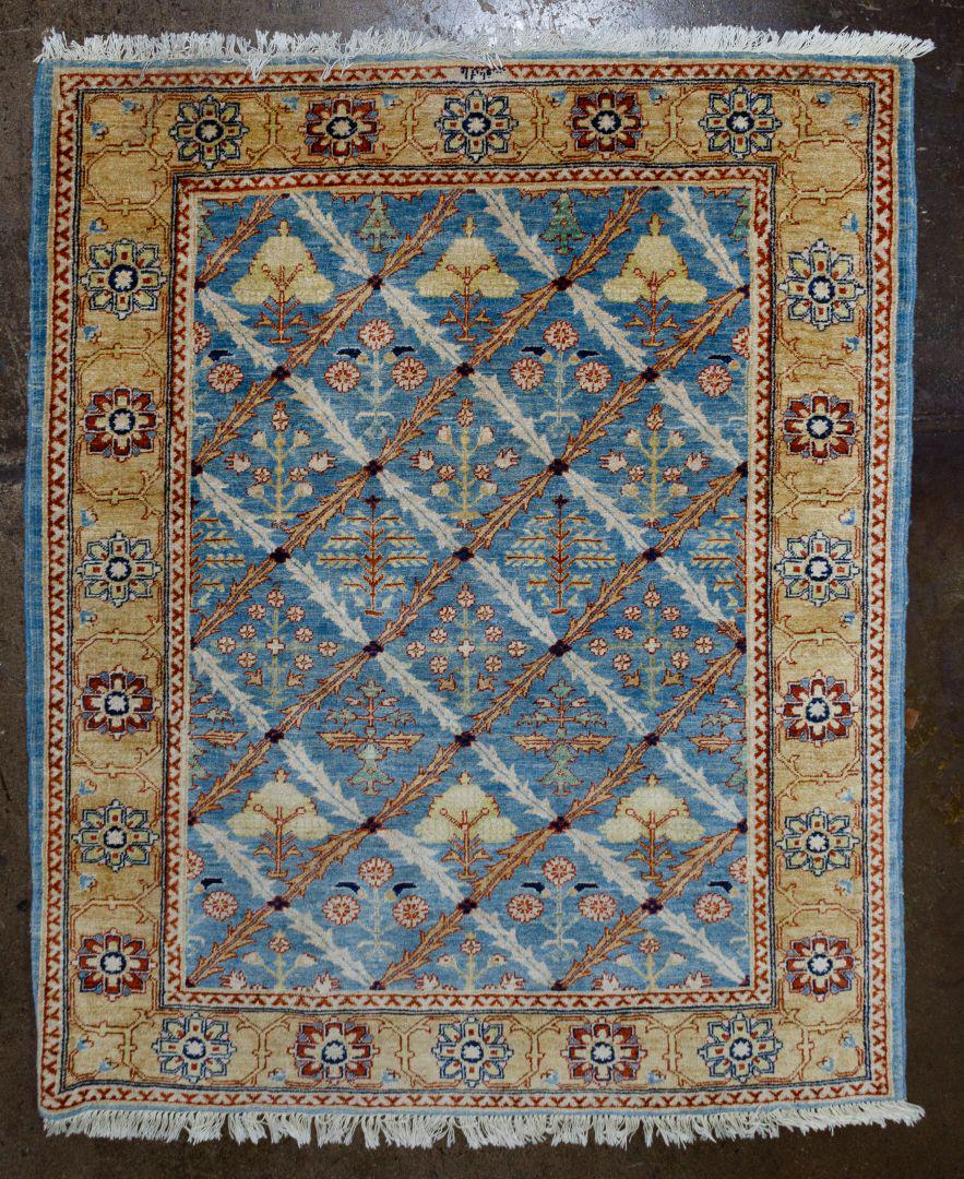 Rug Assortment: Rug Assortment Two items including a Safavieh acrylic light blue with cream boarder and hints of green and rust with fringe and a Verona silk runner in cream, black and grey with fringe Condition: Goo