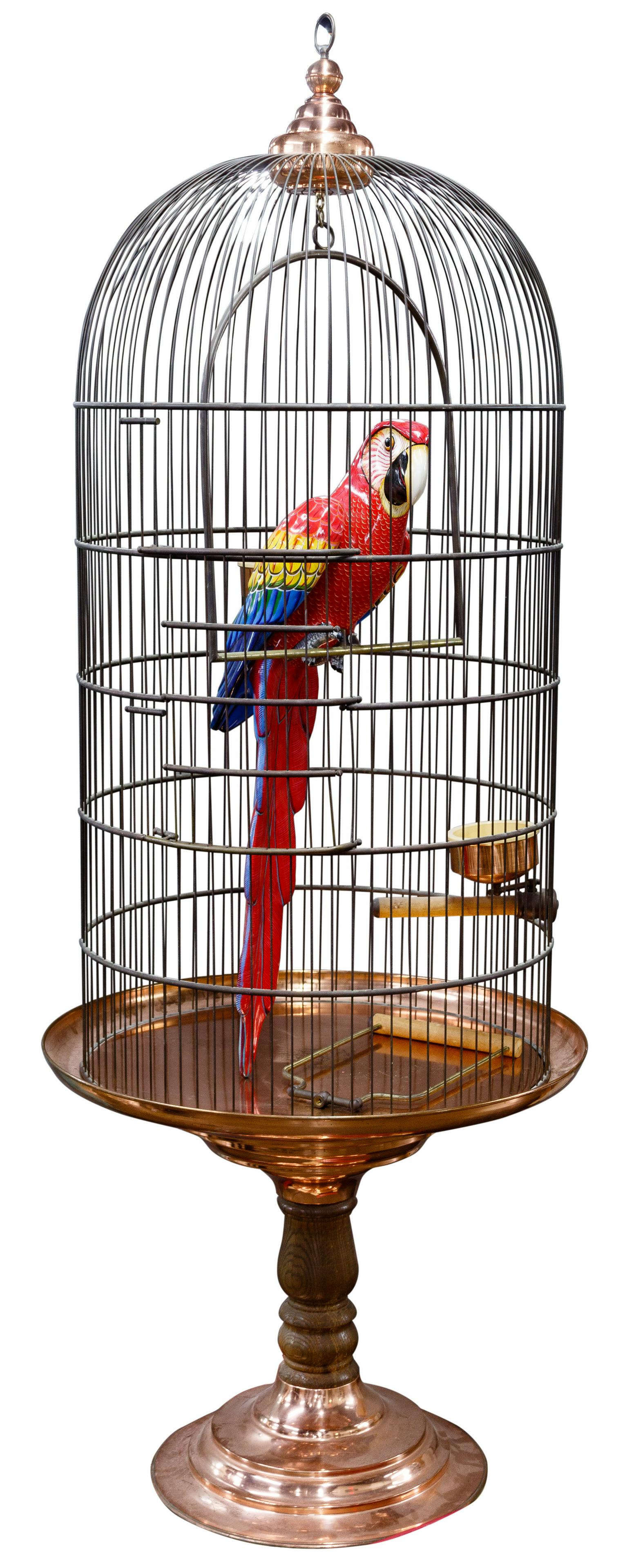 Carlos (Munoz) and Albert (Ickenroth) (Mexican / Dutch,: Carlos (Munoz) and Albert (Ickenroth) (Mexican / Dutch, 20th Century) Sculpture Undated, signed right chest, #125/150, papier mache parrot in very large round metal cage, copper accessories, top and p