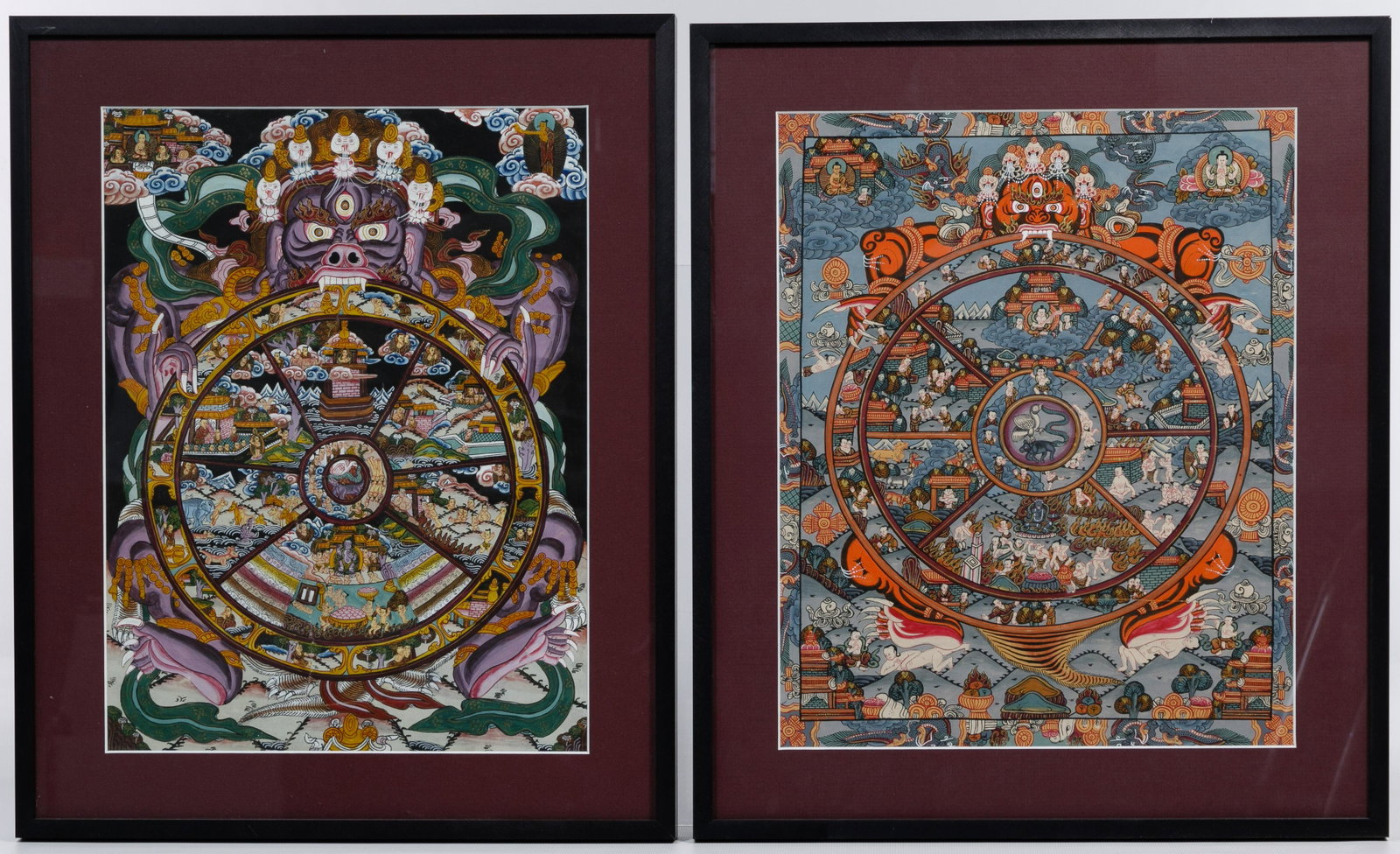 Tibetan Wheel of Life Thangkas: Tibetan Wheel of Life Thangkas 20th century; paintings on silk depicting Tibetan Buddhist symbols; framed alike Condition: Very Good, minor vertical abrasion lower center of black background example; 