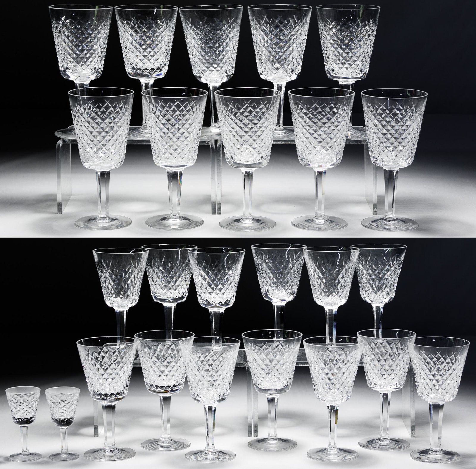 Waterford: Waterford 'Alana' Crystal Assortment Including ten water goblets, thirteen wine glasses and two cordials; acid etched 'Waterford' on underside Condition: Very Good to Good, a wine glass having a tiny 