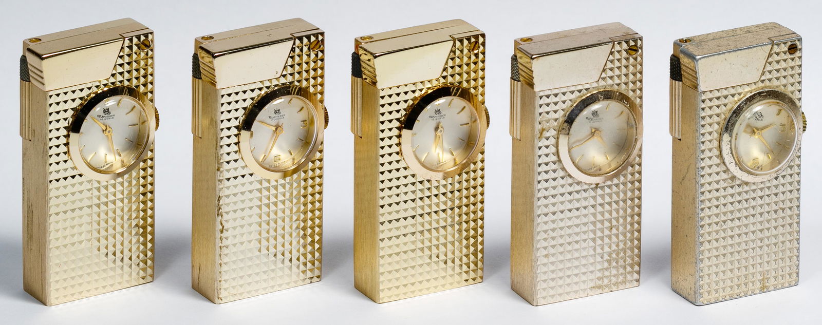 Bucherer Lighter Collection: Bucherer Lighter Collection Five gold-tone lighters having a clock on the front; marked 'Bucherer 17 Jewels' Condition: Very Good to Good, overall light to moderate wear consistent with age and normal