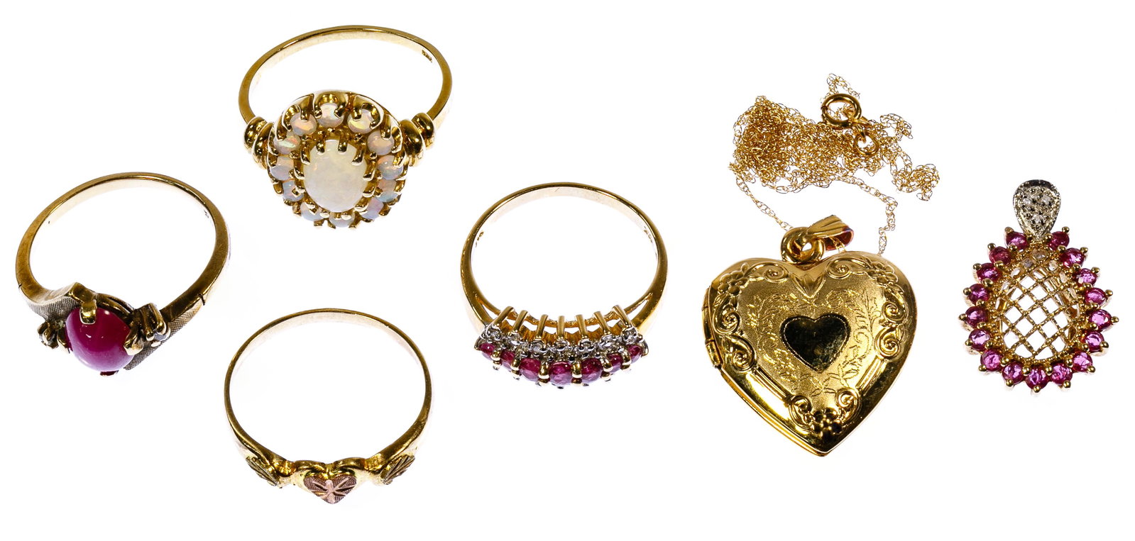 10k Gold Jewelry Assortment: 10k Gold Jewelry Assortment Six items including an opal ring, a star ruby ring, ruby flanked by diamonds ring, gold heart ring, ruby pendant, a gold heart locket and necklace; all marked '10k' Conditi
