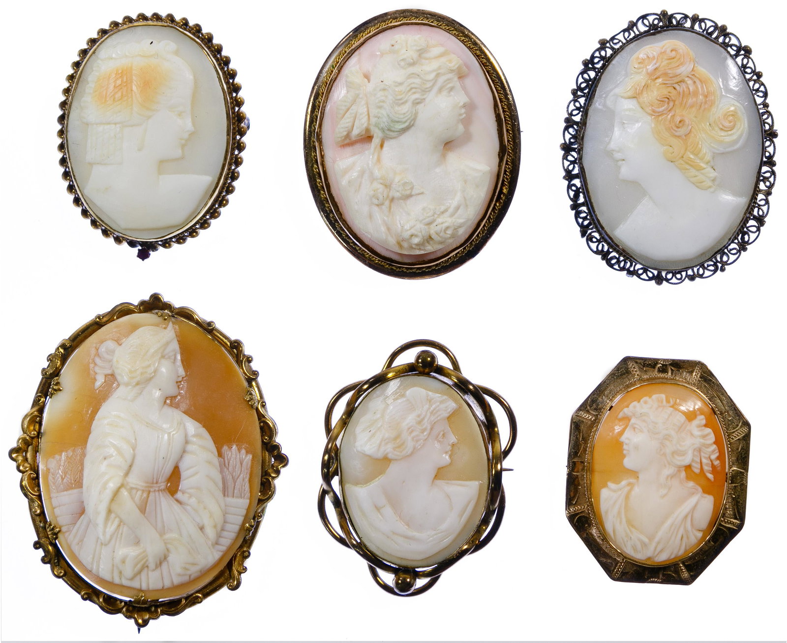 Carved Cameo Pin / Pendant Assortment: Carved Cameo Pin / Pendant Assortment Six items including three having swing up pendant loop and one having small ruby; five having carved shell and the other having carved pale pink coral Condition: 