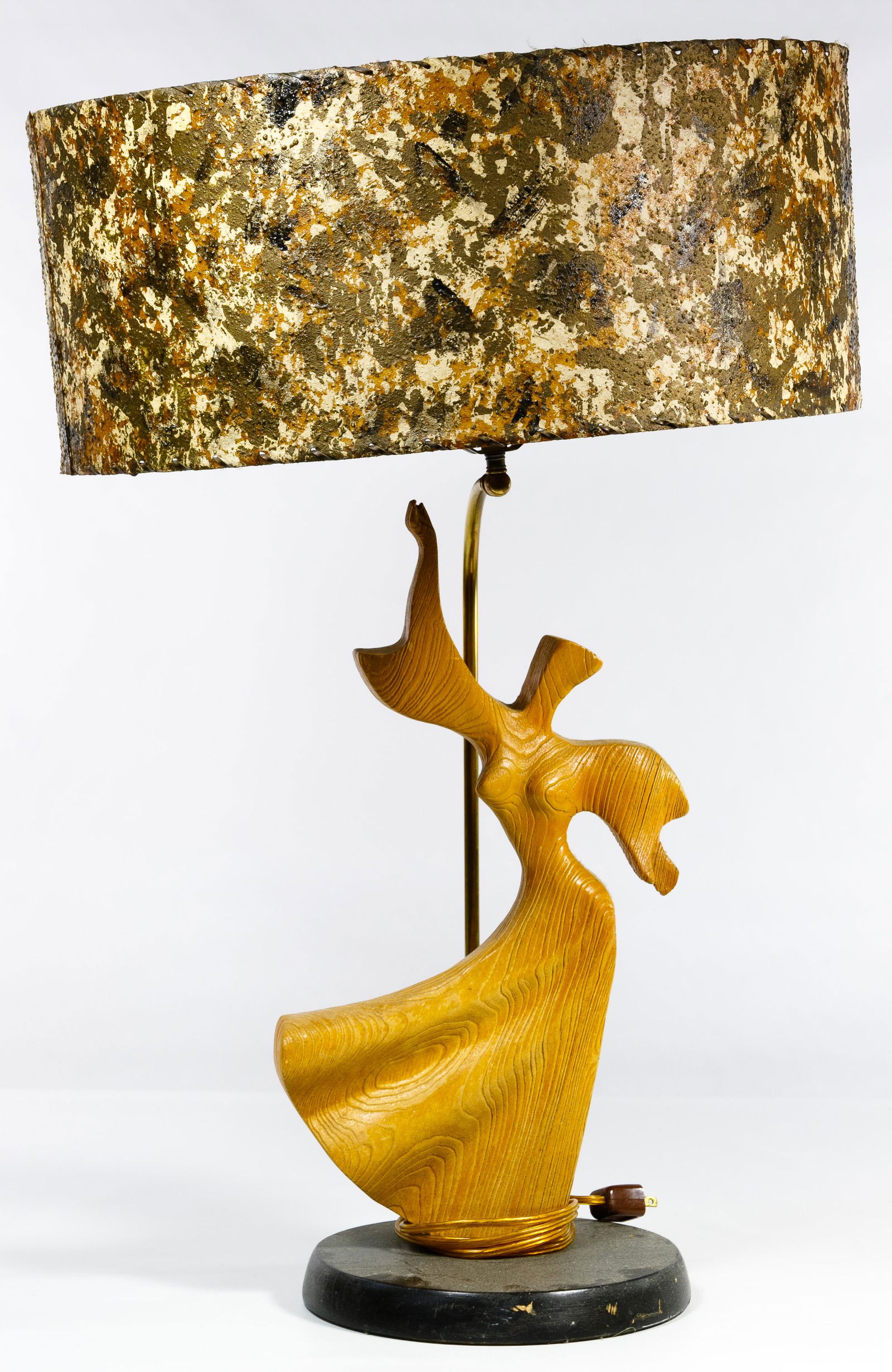 (Attributed to) Heifetz Dancing Woman Lamp: (Attributed to) Heifetz Dancing Woman Lamp Having a carved oak figure of a dancing woman with fiberglass shade; having a dealer tag that notes maker as 'Heifetz' Condition: Good, overall light wear co