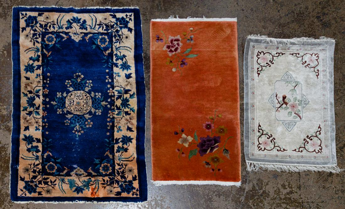 Chinese Area Rug Assortment: Chinese Area Rug Assortment Three items including an Asian floral motif in hues of white, gray, pink; a floral motif runner in the hues of orange, purple and green; and a blue and beige floral rug Con