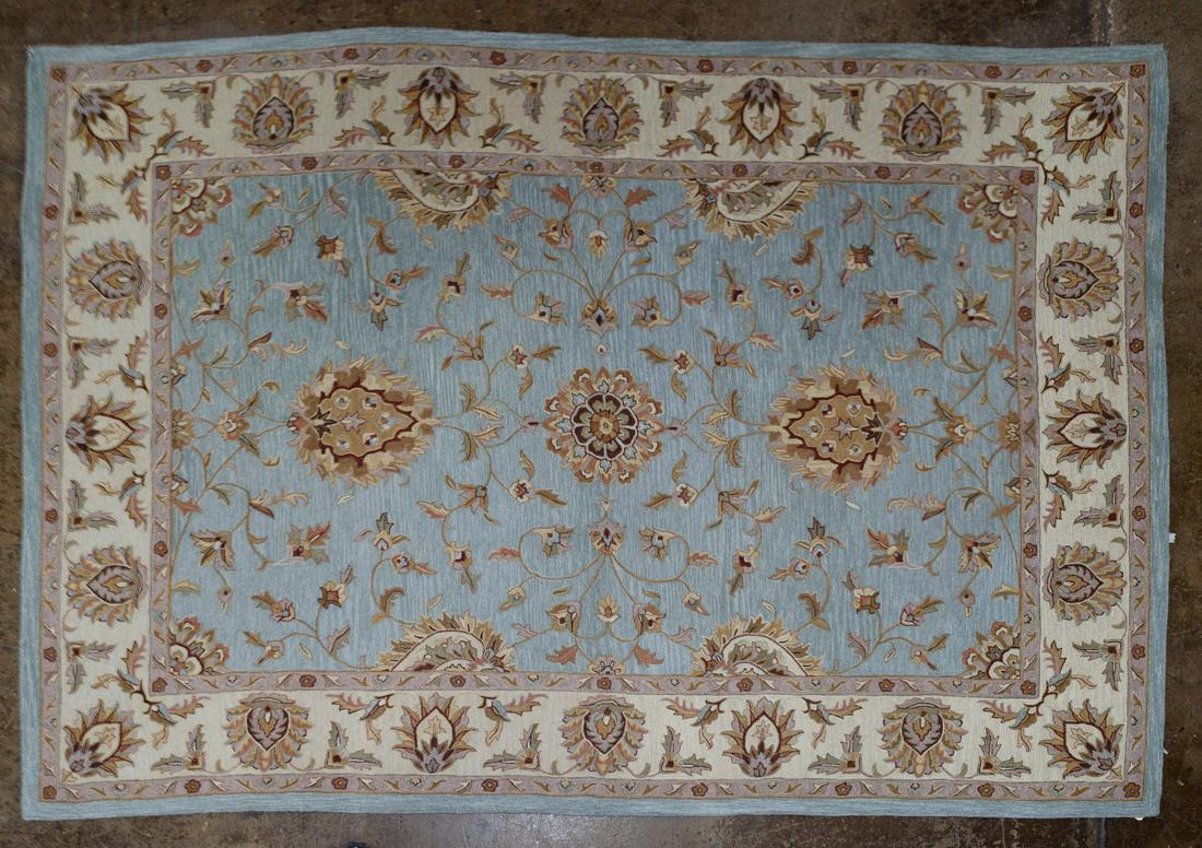 Dynamic Wool Area Rug: Dynamic Wool Area Rug Having a cream border and light blue center along with hues of taupe in medallions Condition: Very Good, overall light wear consistent with age and normal use, one corner fraying