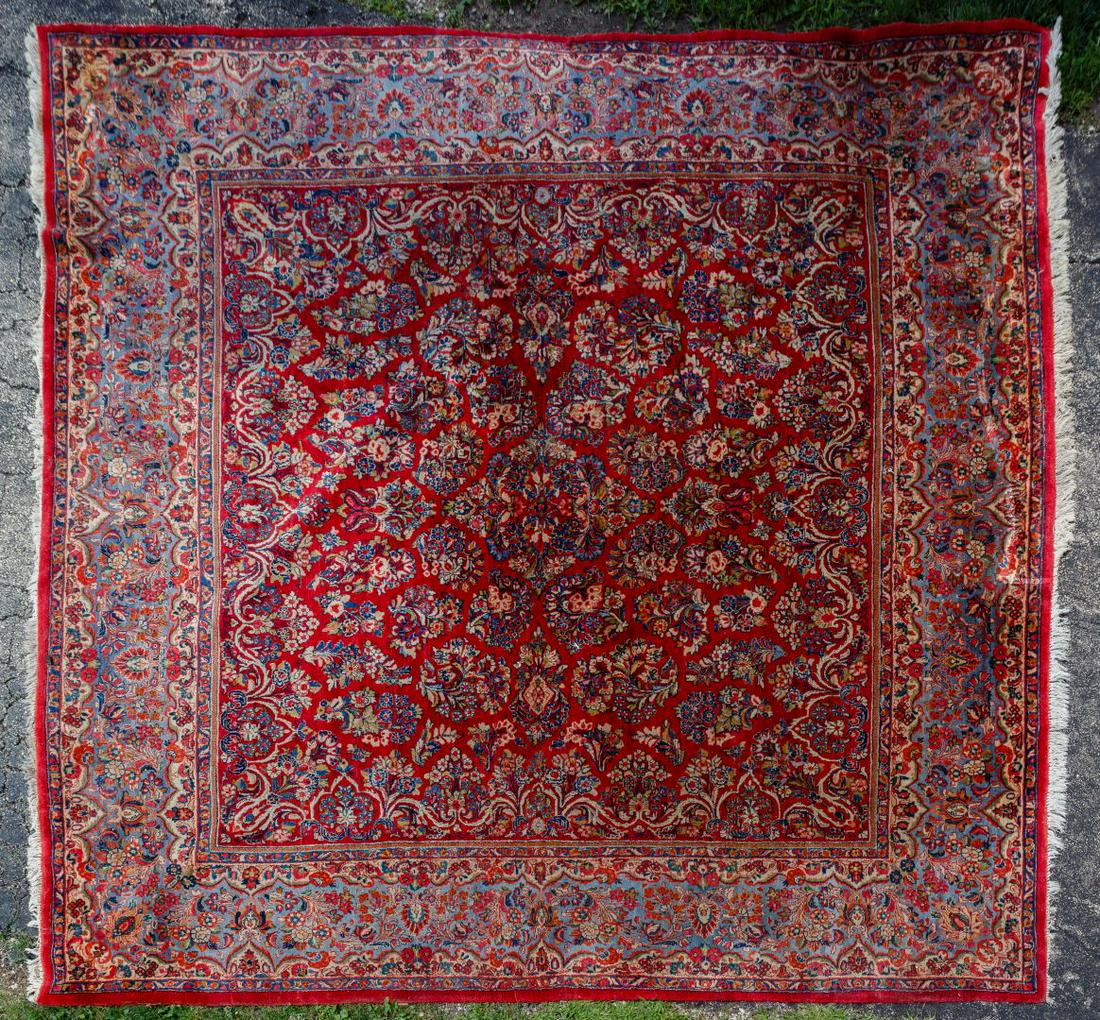Persian Area Rug: Persian Area Rug Abstract floral motif with floral border, having hues of red, blue, cream and gold Condition: Good, moderate wear, some fading and areas of color loss, some fringe missing / shorter t