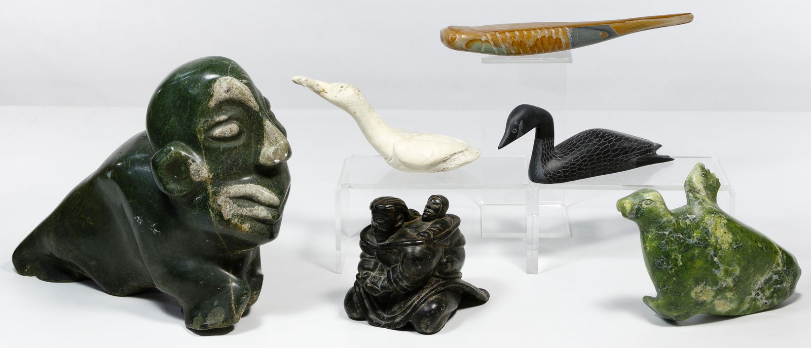 Inuit Soapstone and Whale Bone Carving Assortment: Inuit Soapstone and Whale Bone Carving Assortment Six items including a loon soapstone carving by Samwillie Iqaluq (1993), Arctic Bay soapstone whale inscribed (E5 893) on underside, a whale bone carv