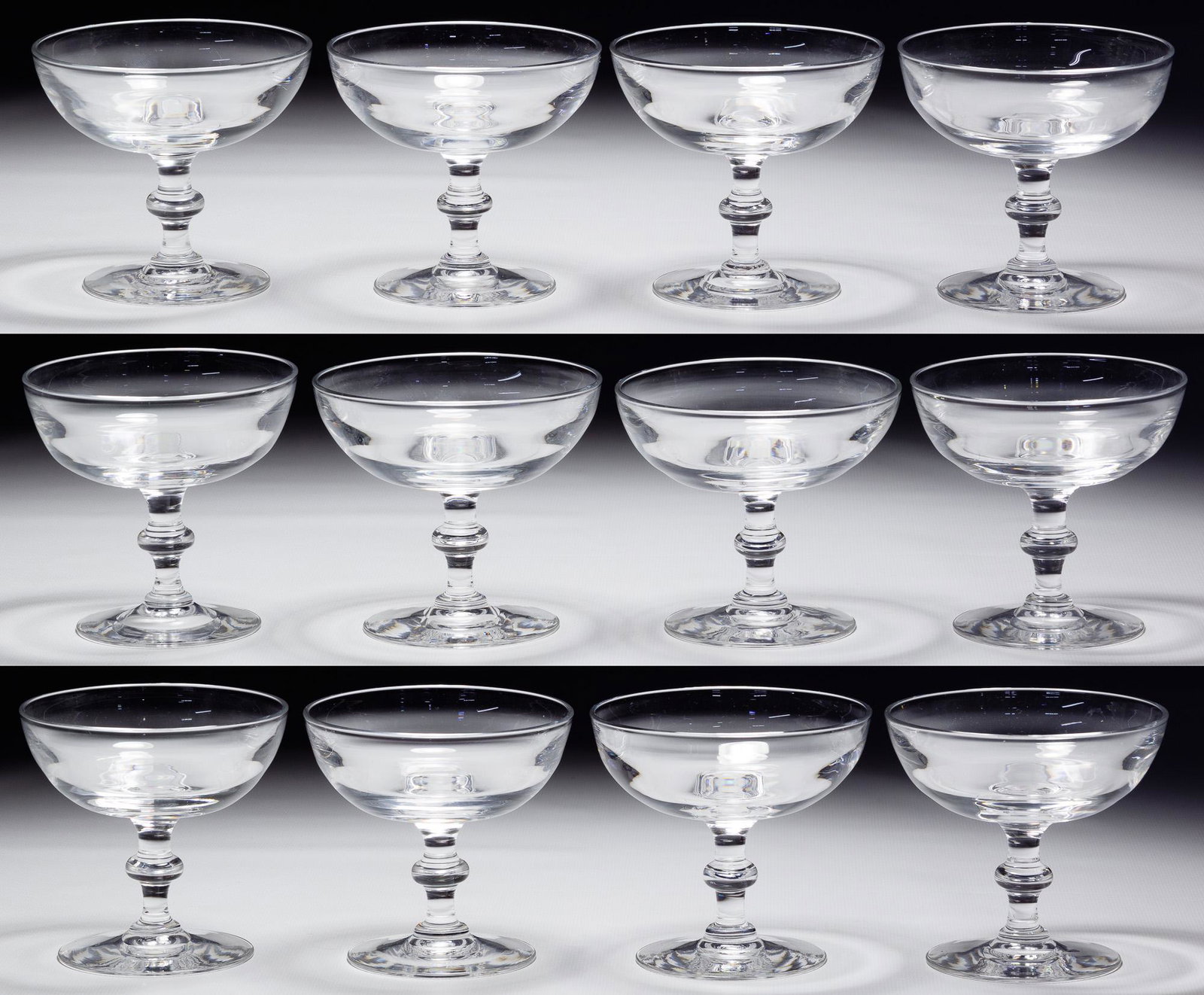 Frederick Carder for Steuben '6268' Champagne Glass: Frederick Carder for Steuben '6268' Champagne Glass Collection Twelve items, clear wafer stem, etch marked on underside of base; in felt sleeves having Marshall Fields tags Condition: Very Good, light