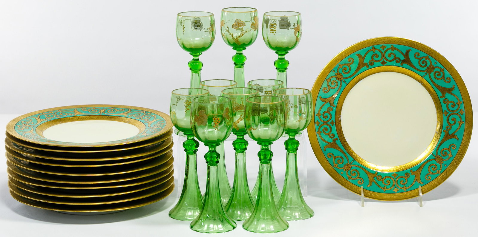Hutschenreuther Selb Plates and Stemware Assortment: Hutschenreuther Selb Plates and Stemware Assortment Including (11) dinner plates having gold and green banding and a botanical motif, marked on backside; and (10) green glass white wine glasses having