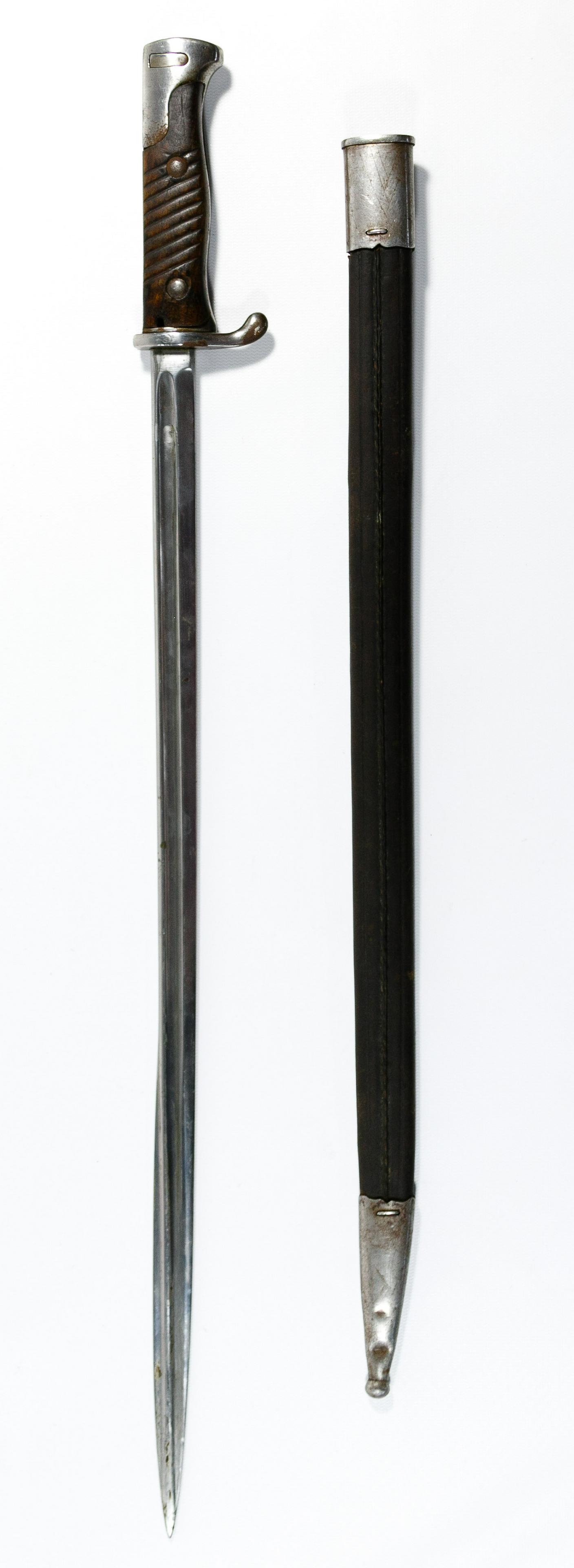World War I Era German Bayonet and Scabbard: World War I Era German Bayonet and Scabbard Simpson and Company Suhl bayonet marked '1167' on figner grip having wood handle, with steel trimmed leather scabbard marked '26378' Condition: Good, areas 