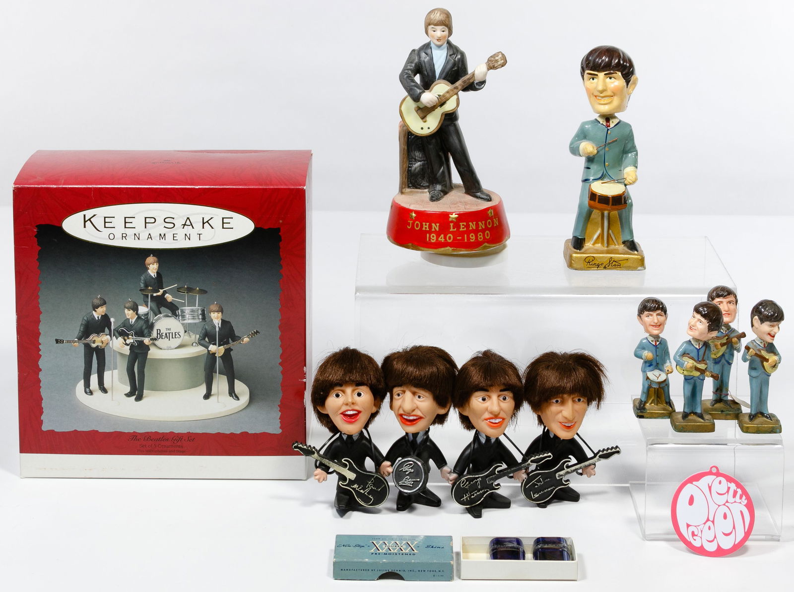 Beatles Collectible Assortment: Beatles Collectible Assortment Thirteen items including a complete set of The Beatles 1964 car mascots brand 'Bobbâ€™n Head' doll figures, John Lennon 'Imagine' music box, complete set of Remco d
