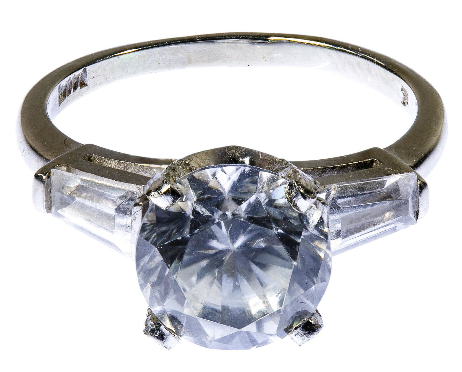 Platinum and Zircon Ring: Platinum and Zircon Ring Having a central zircon weighing approximately 4.38 carats flanked by two baguette cut zircon; including GIA certification Condition: Good, overall light to moderate wear, mos
