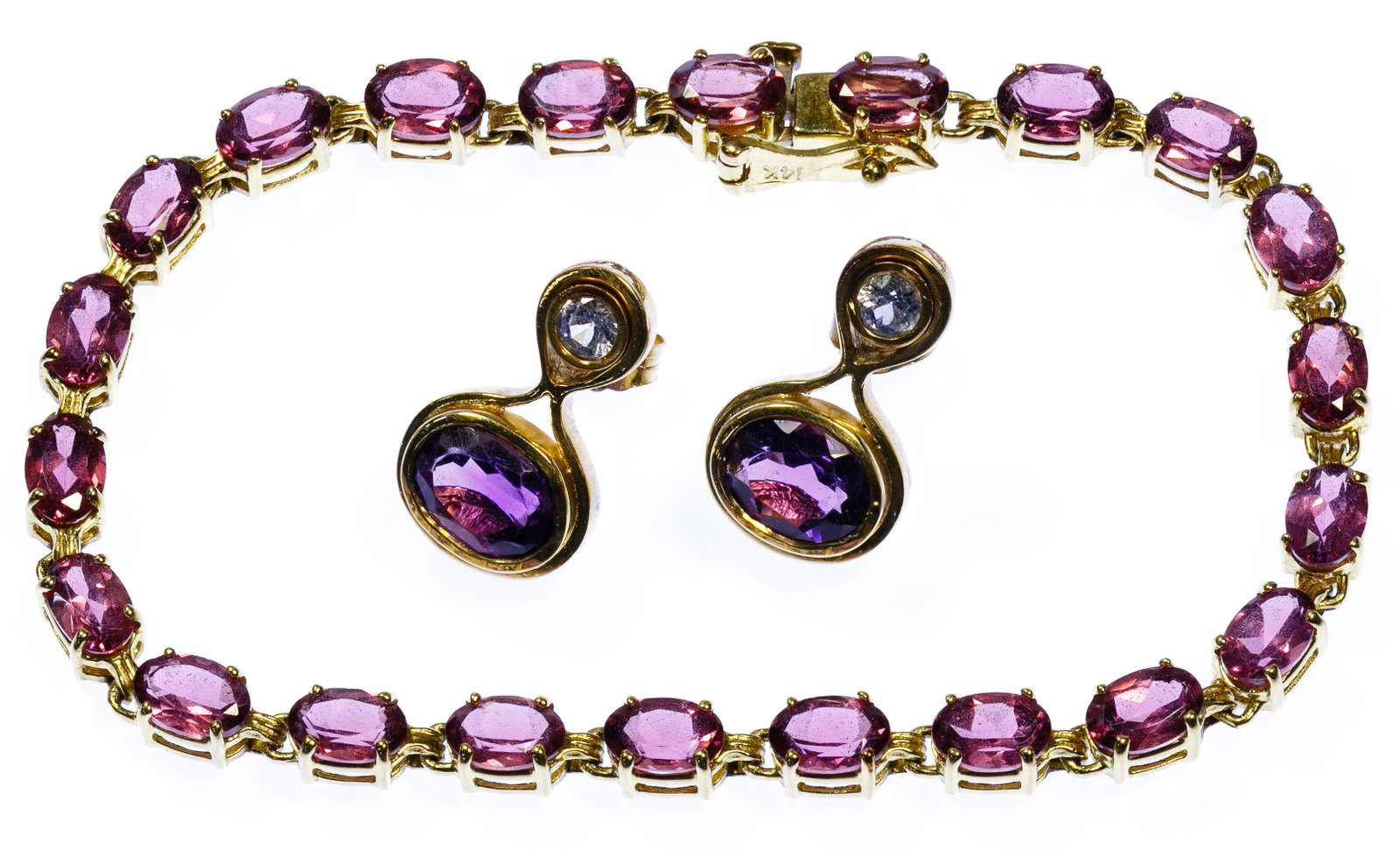 14k Gold and Amethyst Bracelet and Earring Set: 14k Gold and Amethyst Bracelet and Earring Set Pair of studs having oval cut amethyst and round cut white topaz in a bezel setting; and a tennis style bracelet having oval cut amethyst; both marked '1