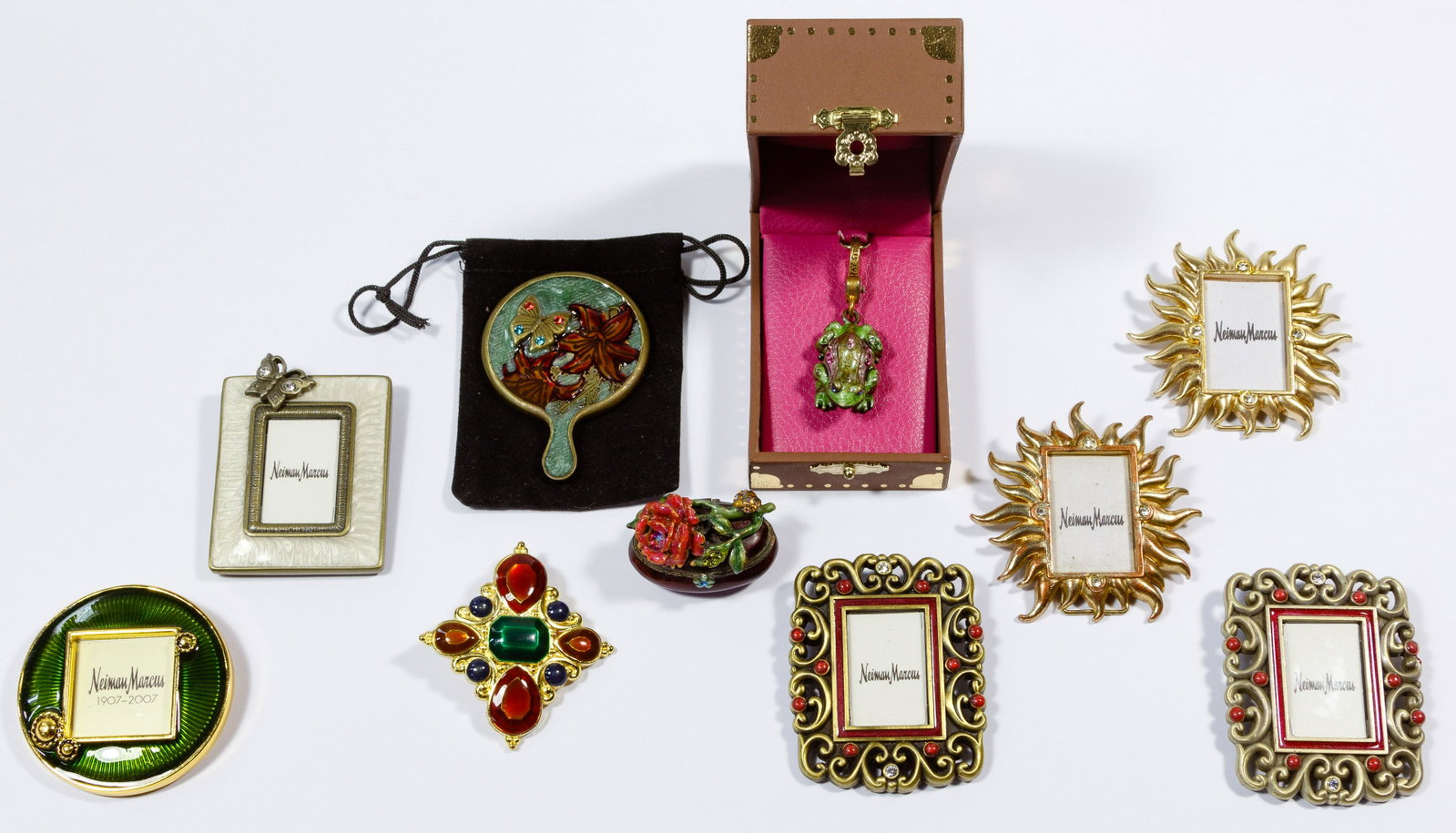 Jay Strongwater Jewelry and Dresser Assortment: Jay Strongwater Jewelry and Dresser Assortment Ten metal, enamel and rhinestone items including six brooches styled as miniature picture frames, a frog pendant, a scarf ring, a trinket box and a minia