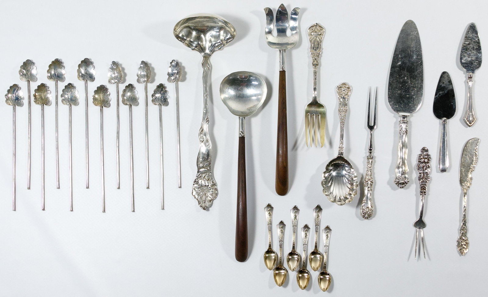 Sterling Silver Flatware Assortment: Sterling Silver Flatware Assortment Including a salad fork and spoon having wood handles, (12) leaf-end sipper straws, (6) Gorham 'Japanese' demitasse spoons having gold wash bowls, a punch ladle, a c