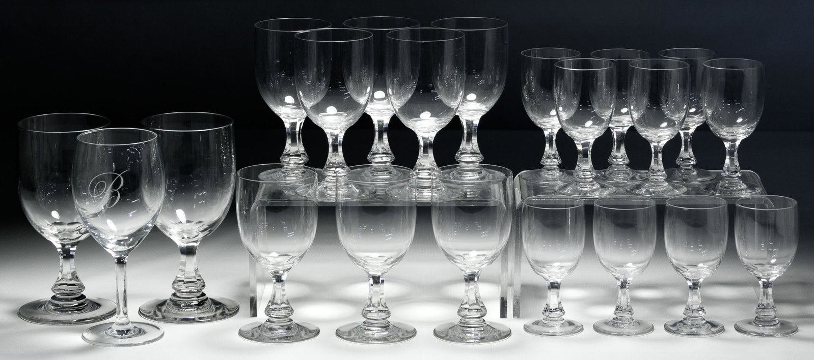 Baccarat Crystal 'Gascogne' Stemware Assortment: Baccarat Crystal 'Gascogne' Stemware Assortment Twenty-one items including (2) tall water goblets, (8) clarets and (10) sherry glasses; together with a plain wine glass; all having maker's mark on und