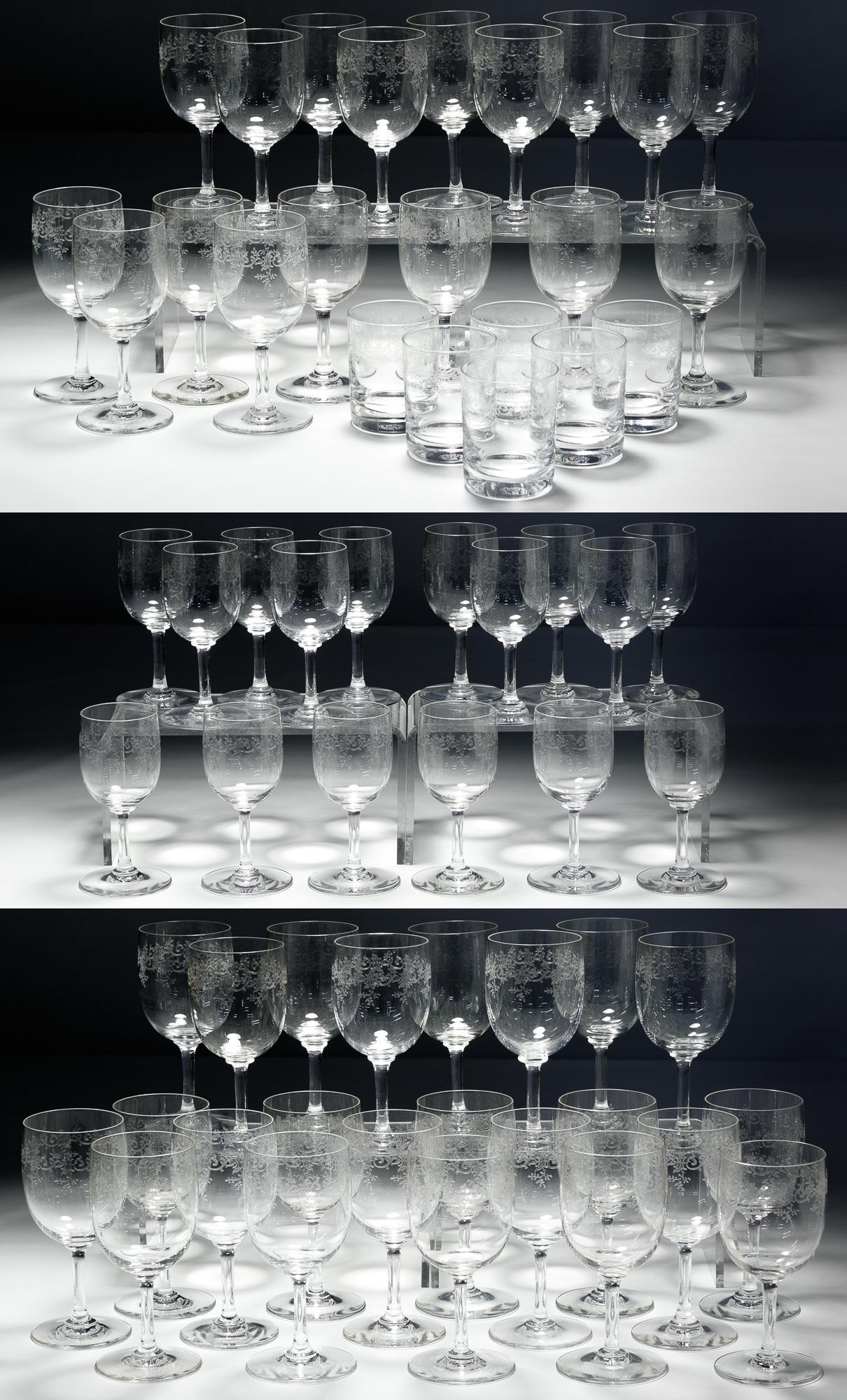 Baccarat Crystal 'Sevigne' Stemware and Glass: Baccarat Crystal 'Sevigne' Stemware and Glass Assortment Sixty-two pieces having an etched pattern, including (23) water goblets, (17) wine glasses, (16) clarets and (6) old fashioneds; maker's mark o
