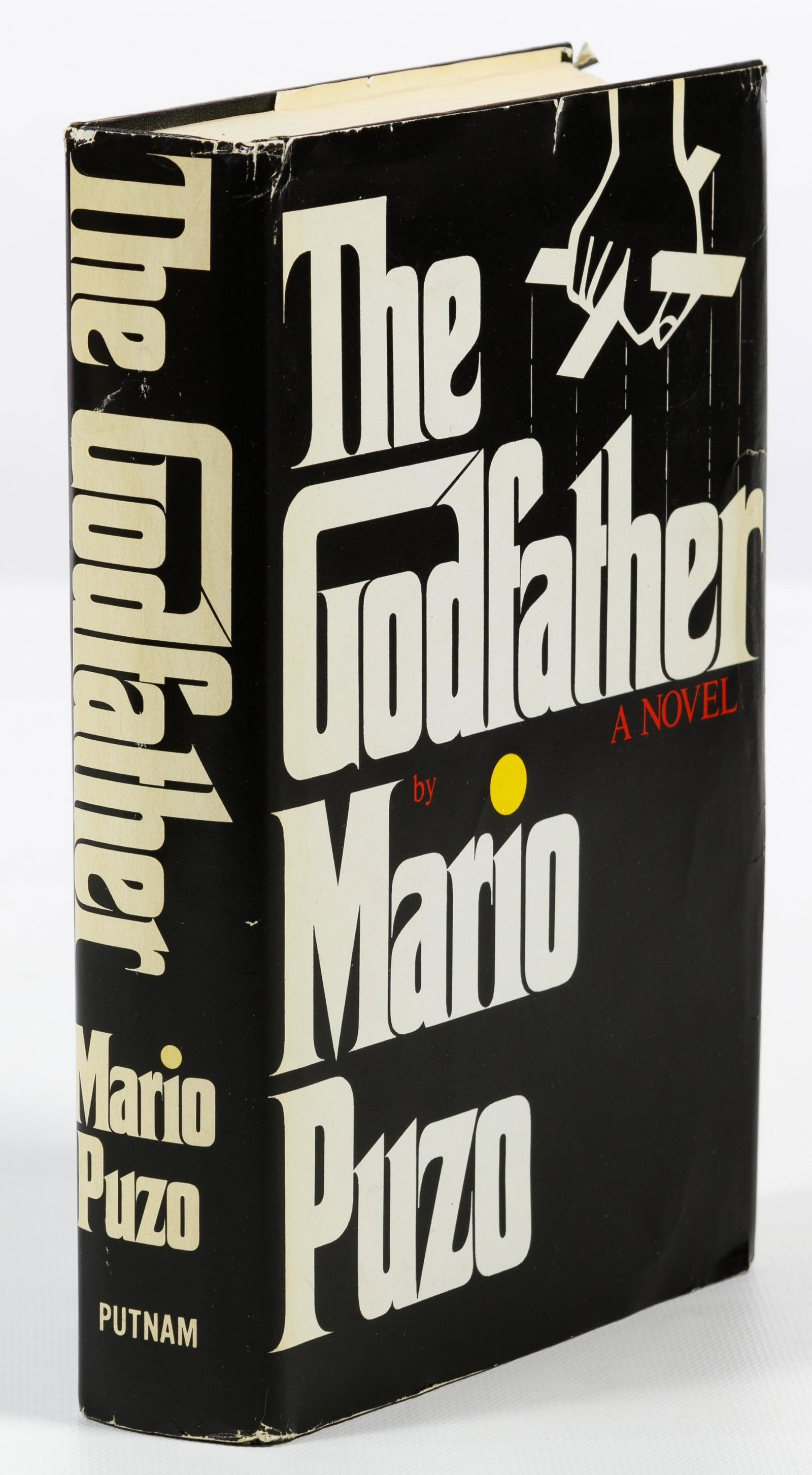 Mario Puzo 'The Godfather' Book: Mario Puzo 'The Godfather' Book Copyright 1969, printed in the United States; including dust jacket Condition: Very Good, light wear on pages; dust jacket having stains and tears Length: 8 1/2 inches 