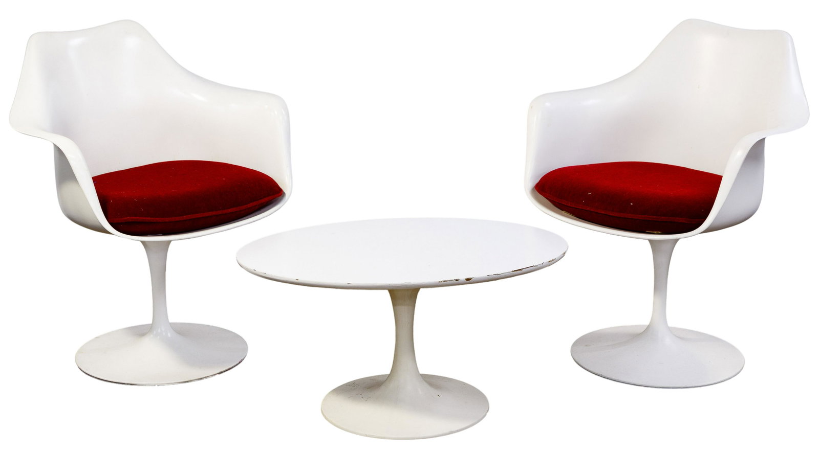 Eero Saarinen for Knoll Tulip Chairs: Eero Saarinen for Knoll Tulip Chairs Three items including two swivel arm chairs having red cushions; together with an oval side table in the style of Knoll measuring 15'T x 29.625'W x 19.75'D Conditi