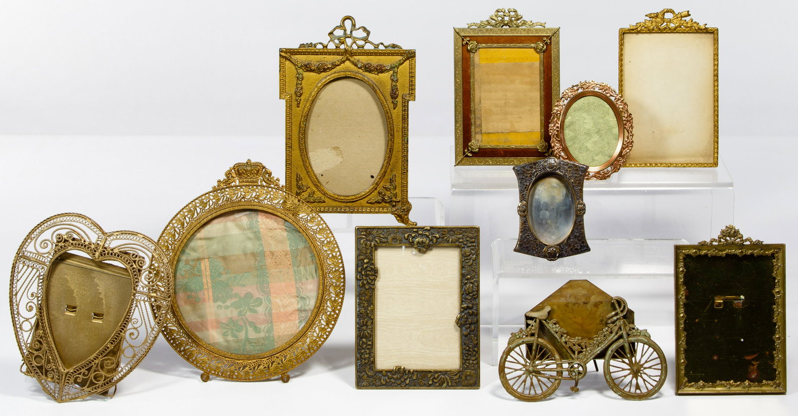 Victorian Metal Frame Assortment: Victorian Metal Frame Assortment Ten items having various shapes and sizes; most having floral motifs; one depicting a bicycle; one marked 'Marshall Field & Co.'; property from a Chicago, Illinois col