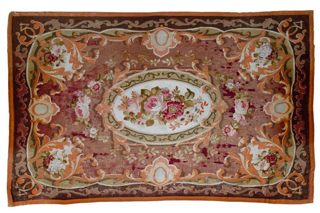 Aubusson Wool Needlepoint Rug and Pillow: Aubusson Wool Needlepoint Rug and Pillow Floral medallion center having wine, orange and brown hues; together with a Bacchus style throw pillow; property from a Chicago, Illinois collector Condition: 