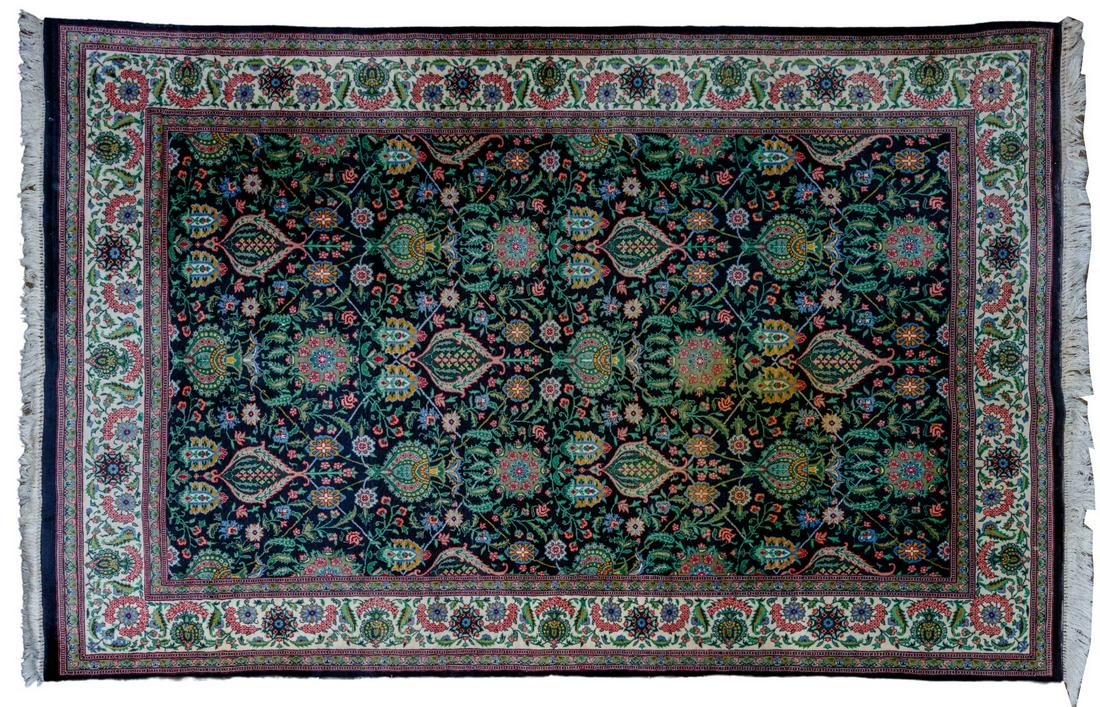 Persian Style Wool Area Rug: Persian Style Wool Area Rug Floral and abstract motif having a black background and hues of cream, blue, green and yellow, short fringe; property from a Chicago, Illinois collector Condition: Very Goo