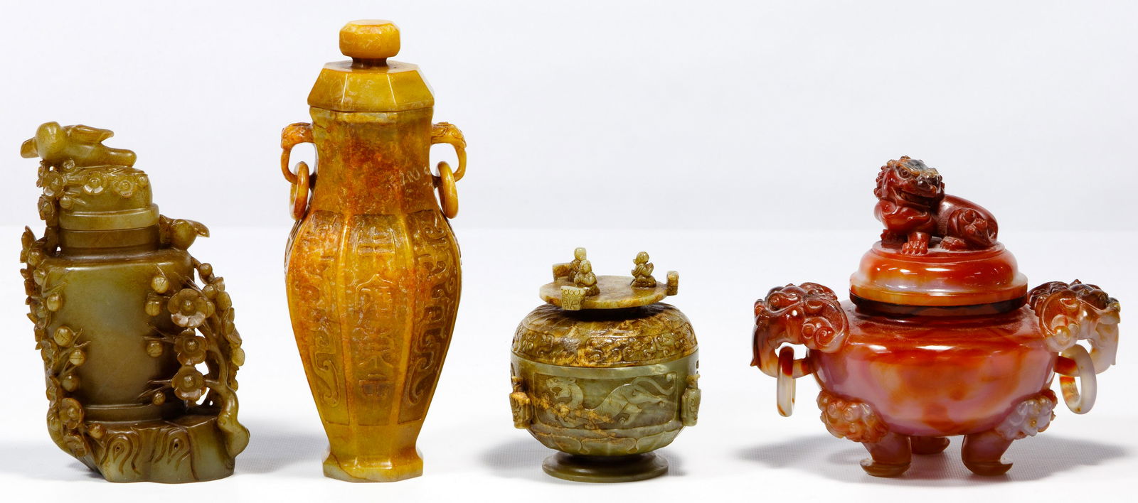 Chinese Jadeite Jade Vessel Assortment: Chinese Jadeite Jade Vessel Assortment Three examples including an amber colored octagonal lidded vase having ring handles suspended from taotie masks with archaistic dragon and seal script carvings,