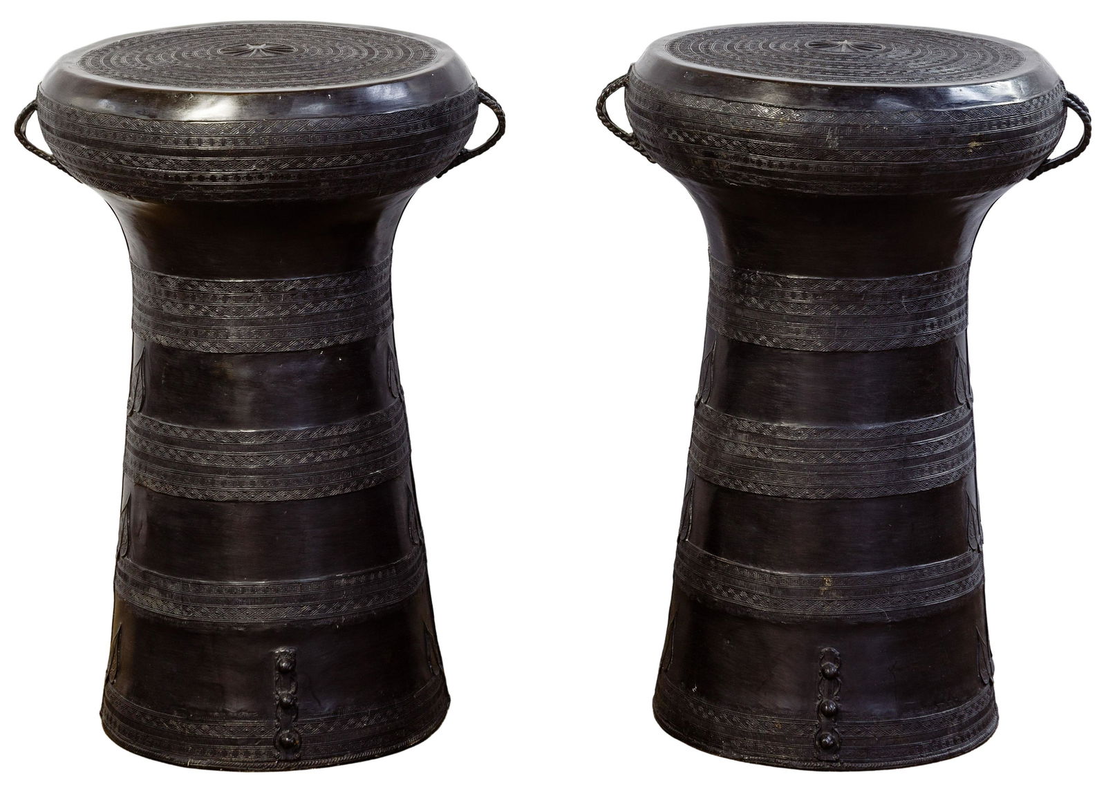 Southeast Asian Style Rain Drums: Southeast Asian Style Rain Drums 20th/21st century, pair of black metal hollow drums having geometric and leaf decor; property from a Highland Park, Illinois collector Condition: Very Good, overall li