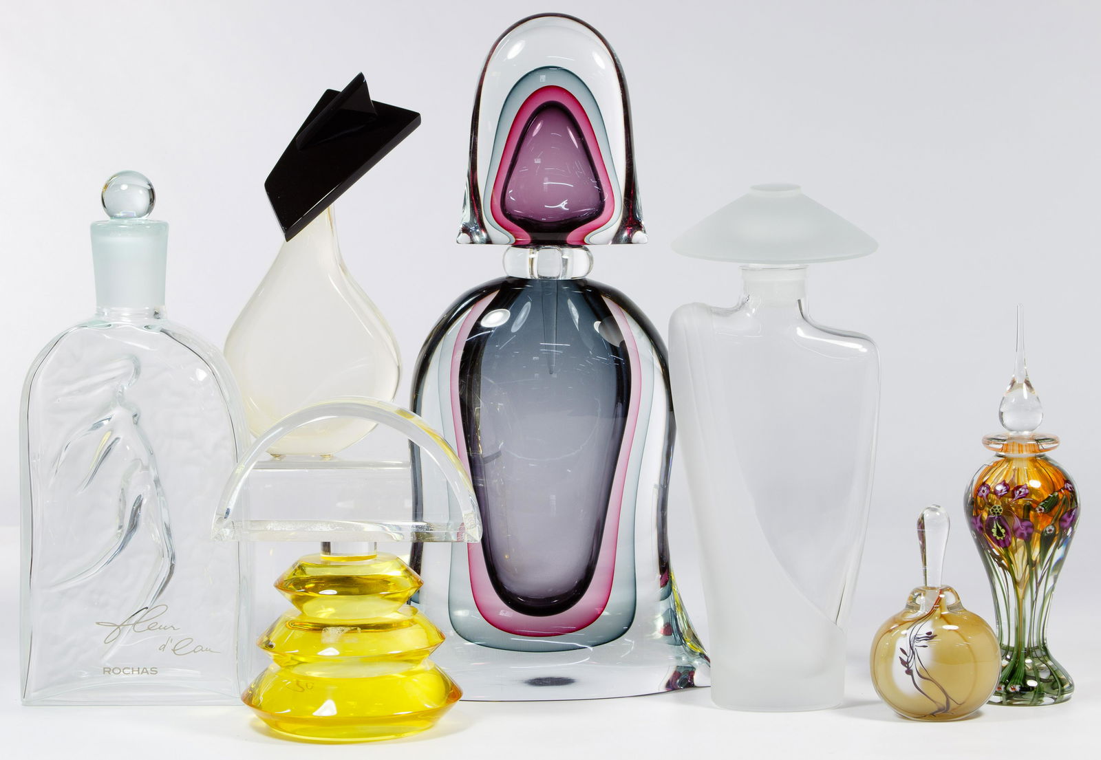Perfume Display Bottle Assortment: Perfume Display Bottle Assortment Seven items including a Rochas Fleuer d'Eau perfume factice bottle having a frosted female design on reverse, an example marked 'Vandermark' on base, three unmarked a