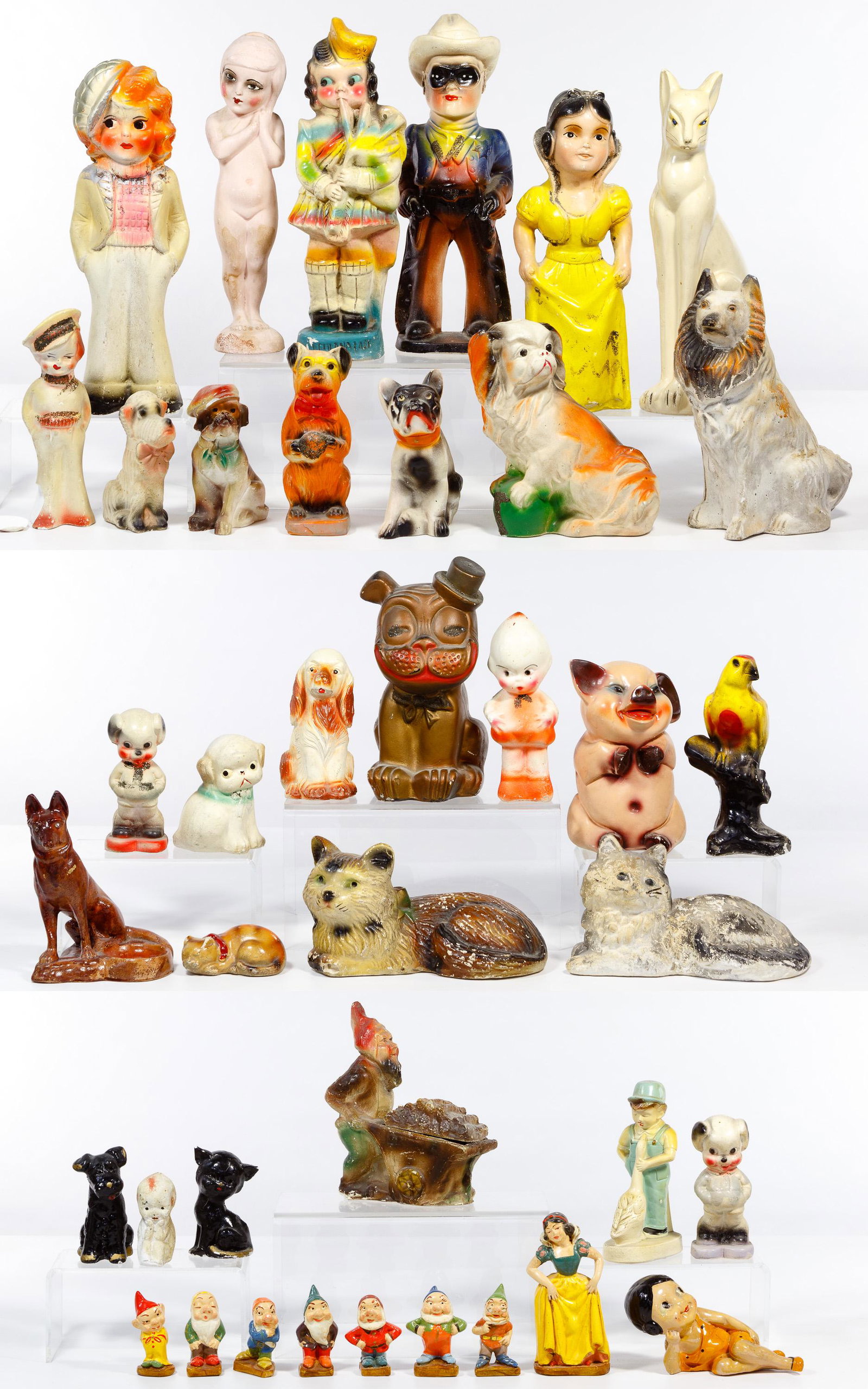 Chalkware Figurine Assortment: Chalkware Figurine Assortment Thirty-nine items from the early to mid-20th century including five cats, thirteen dogs, a large Snow White, a small Snow White and seven dwarves, a Lone Ranger, an eroti