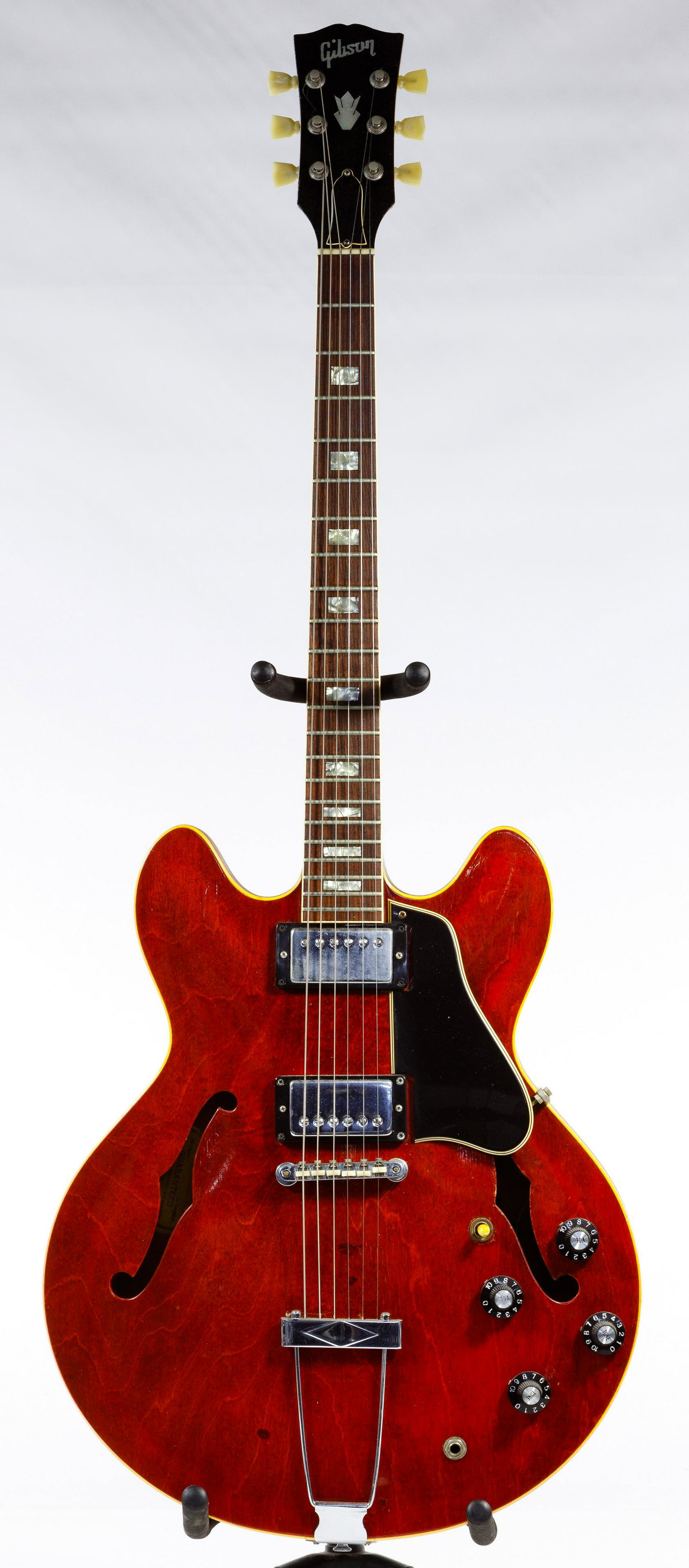 Gibson 1968 Electric Guitar: Gibson 1968 Electric Guitar 1968, serial #860666, having hollow-body and double cutaways, f-holes, a cherry finish, a rosewood fingerboard, a black plastic pick guard, four tuning knobs and a three wa