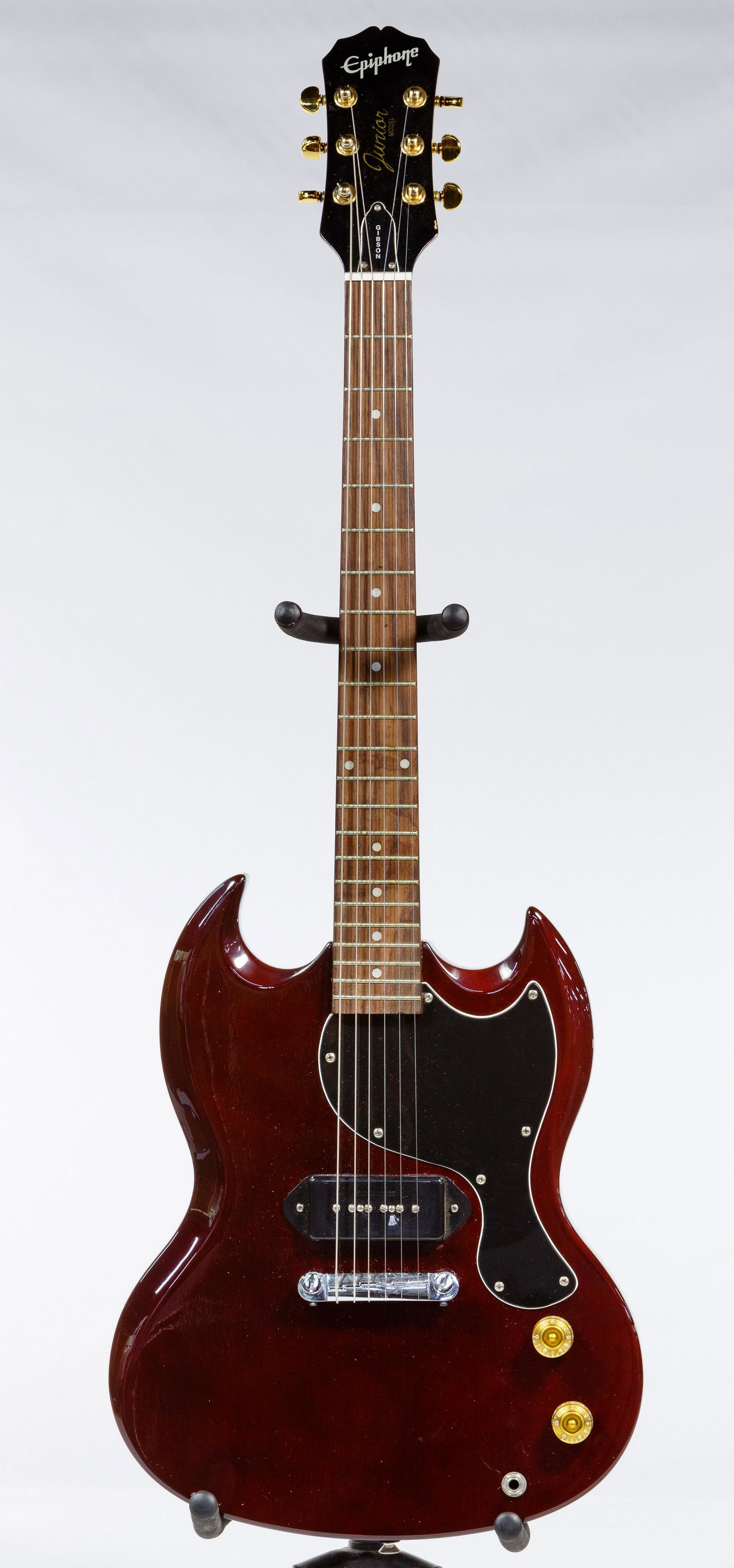 Gibson Epiphone Les Paul Junior Guitar: Gibson Epiphone Les Paul Junior Guitar Serial #J7020306, wine colored solid body, rosewood neck, double cut, single pickup, brass color knobs and tuner pins; together with soft gig bag; property from 