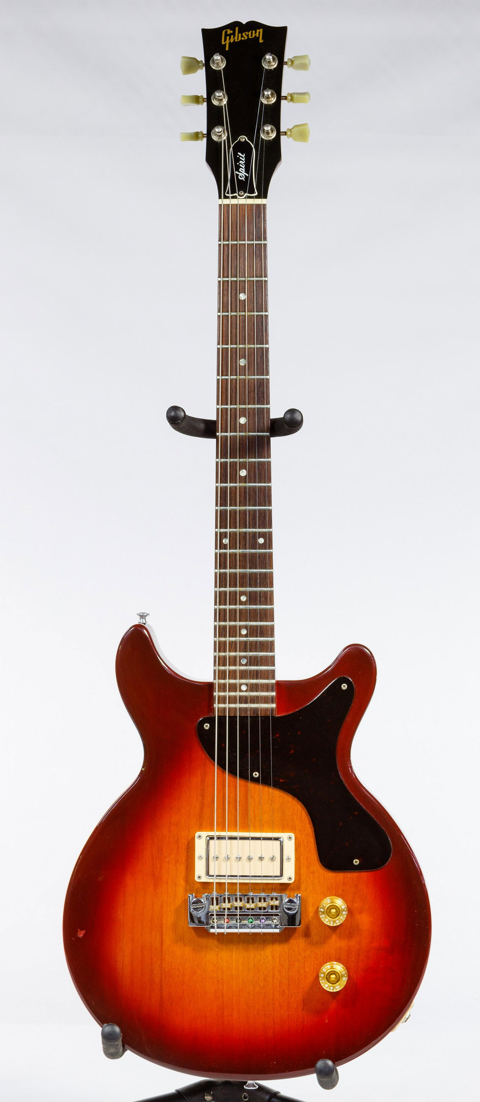 Gibson Spirit Electric Guitar: Gibson Spirit Electric Guitar Serial #80954589, tobacco burst, solid body, double cut away having a single pickup, two gold color knobs and tortoise pick guard; together with a hard Gibson case; prope