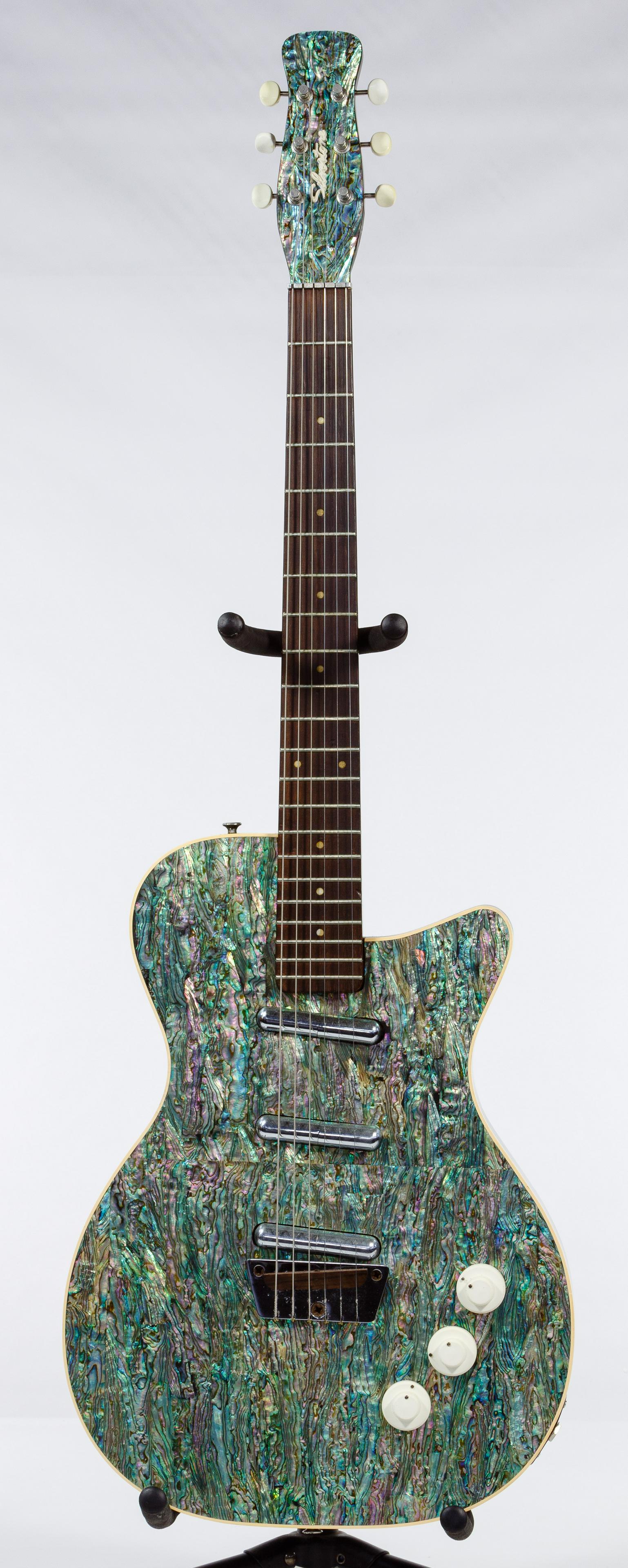 Silvertone 3305/U3 Electric Guitar: Silvertone 3305/U3 Electric Guitar Solid body having three pickups with rosewood neck, abalone veneer; together with hard case; property from a Waukegan, Illinois estate Condition: Good, crack on uppe