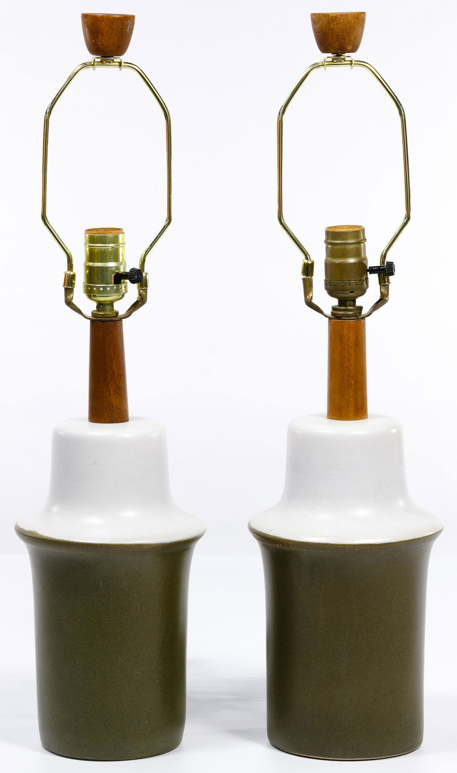 Jane and Gordon Martz for Marshall Studios Ceramic: Jane and Gordon Martz for Marshall Studios Ceramic Table Lamps Two matching lamps having olive green and white ceramic body with teak wood neck and finials; marked 'Marshall' at lower edge by cord por