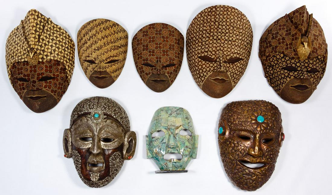 Asian Style Decorative Mask Assortment: Asian Style Decorative Mask Assortment Eight items, 20th century, including six Indonesian batik wood masks, two Nepalese wood and metal masks set with stones and one decorative stone-veneered mask on