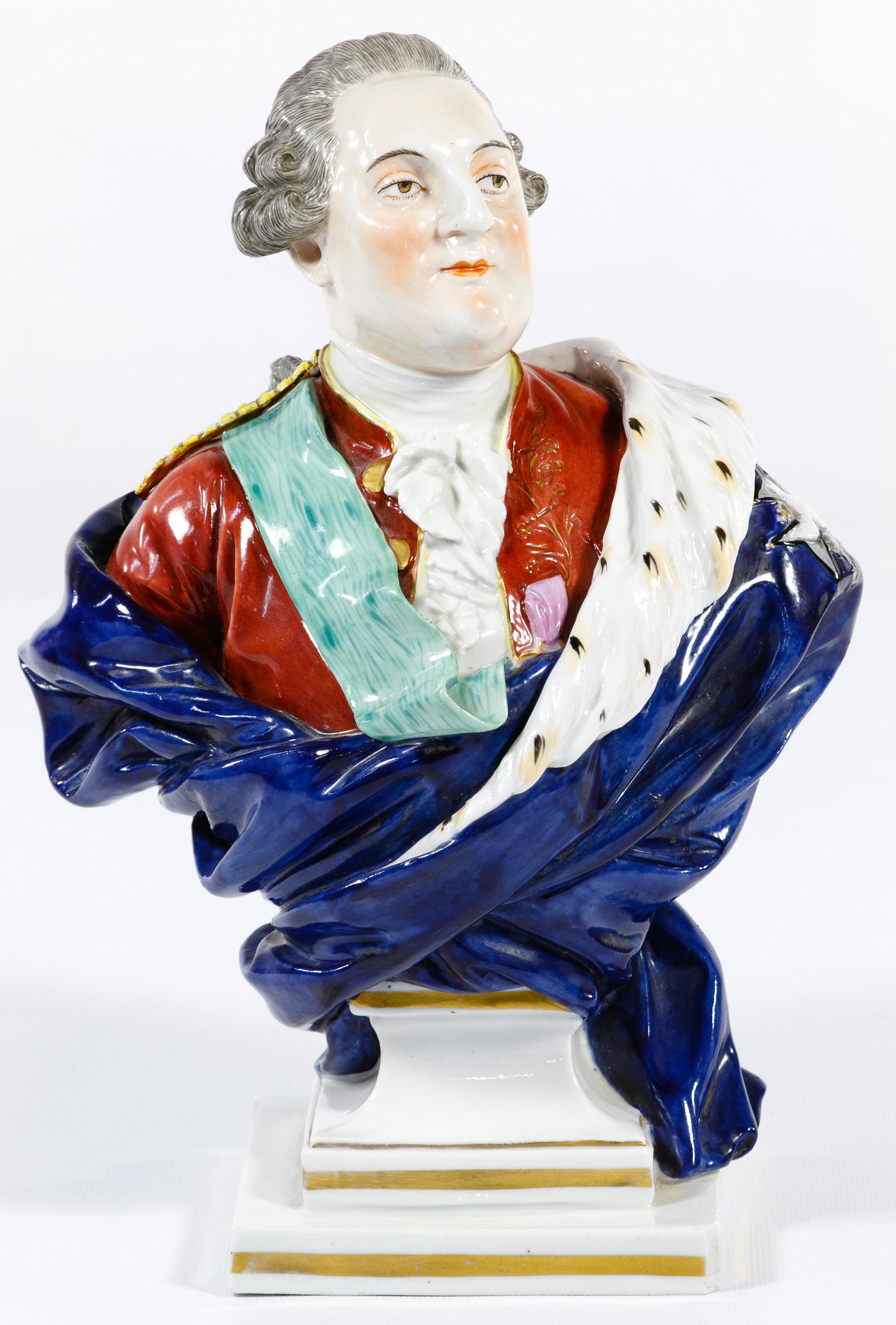 Dresden Porcelain Bust: Dresden Porcelain Bust Modeled after French King Louis in blue royal robes, a green sash and coat of arms; marked on the underside Condition: Good, light wear, chip on bottom right corner Height: 11 3