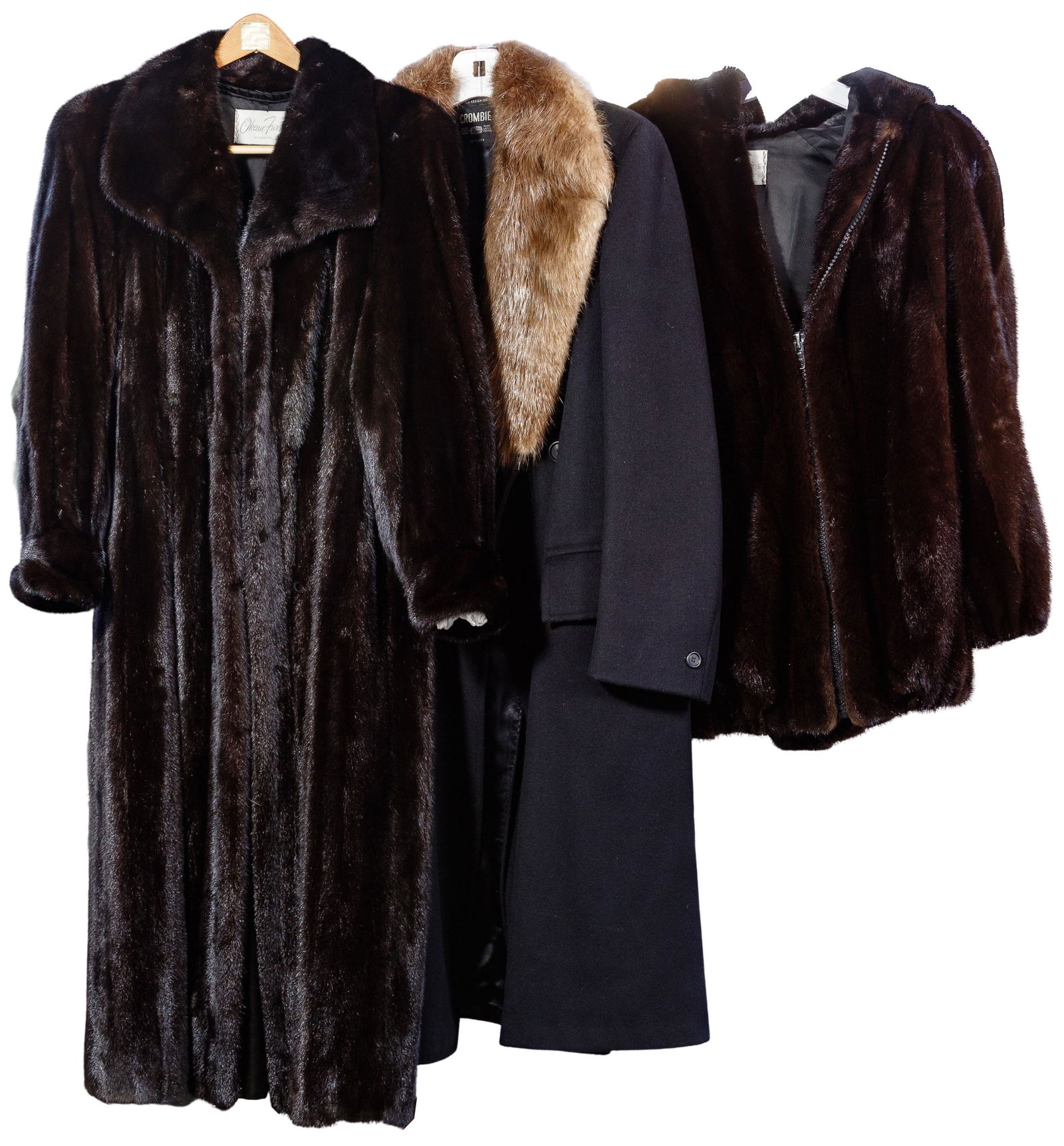 Fur Coat Assortment: Fur Coat Assortment Three women's coats including a dark brown mid-length mink jacket having a hood, elastic cuffs, elastic around the lower edge, a zipper front closure and slit pockets, size XL; a f