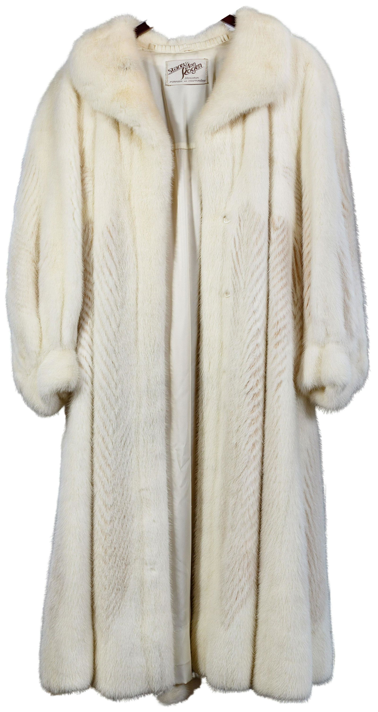 White Mink Coat: White Mink Coat Full length having chevron patterned vertical stripes, three-quarter length cuffed balloon sleeves, slit pockets and hook and eye closures; property from a Highland Park, Illinois coll