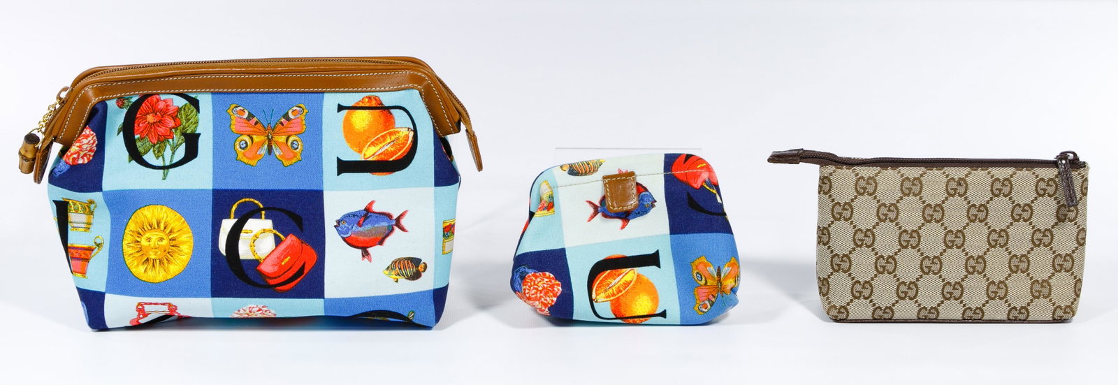 Gucci Canvas Purse, Change Purse and Makeup Bag: Gucci Canvas Purse, Change Purse and Makeup Bag Three items including a matching purse and change purse having animals, flowers and fruit images and Controllato makeup bag having original tag and pric
